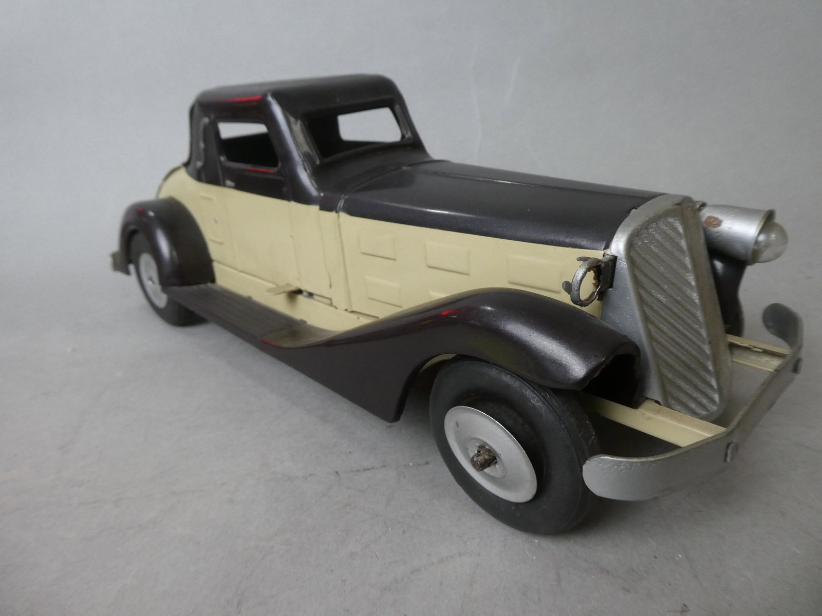 1930's Pressed Steel Marx Coupe Art Deco Car: 1930's Pressed Steel Marx Coupe Art Deco Car. Measurements in inches: 15 long Condition:Has been repainted. Missing headlight and taillight Shipping:We offer in-house shipping. Item(s) will be packed 