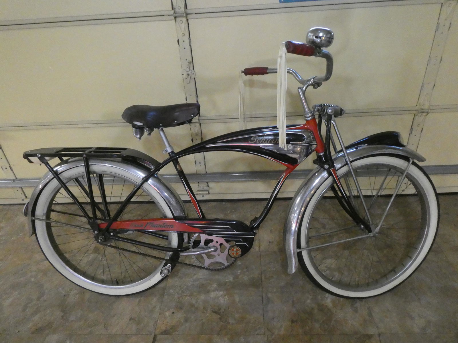 1950's Original Schwinn Black Phantom Bike Bicycle: 1950's Original Schwinn Black Phantom Bike Bicycle with pedals, chainguard, horntank, front light, rear carrier,seat ,replacement wheels. Measurements in inches: 26" Condition:Frame has been repainted