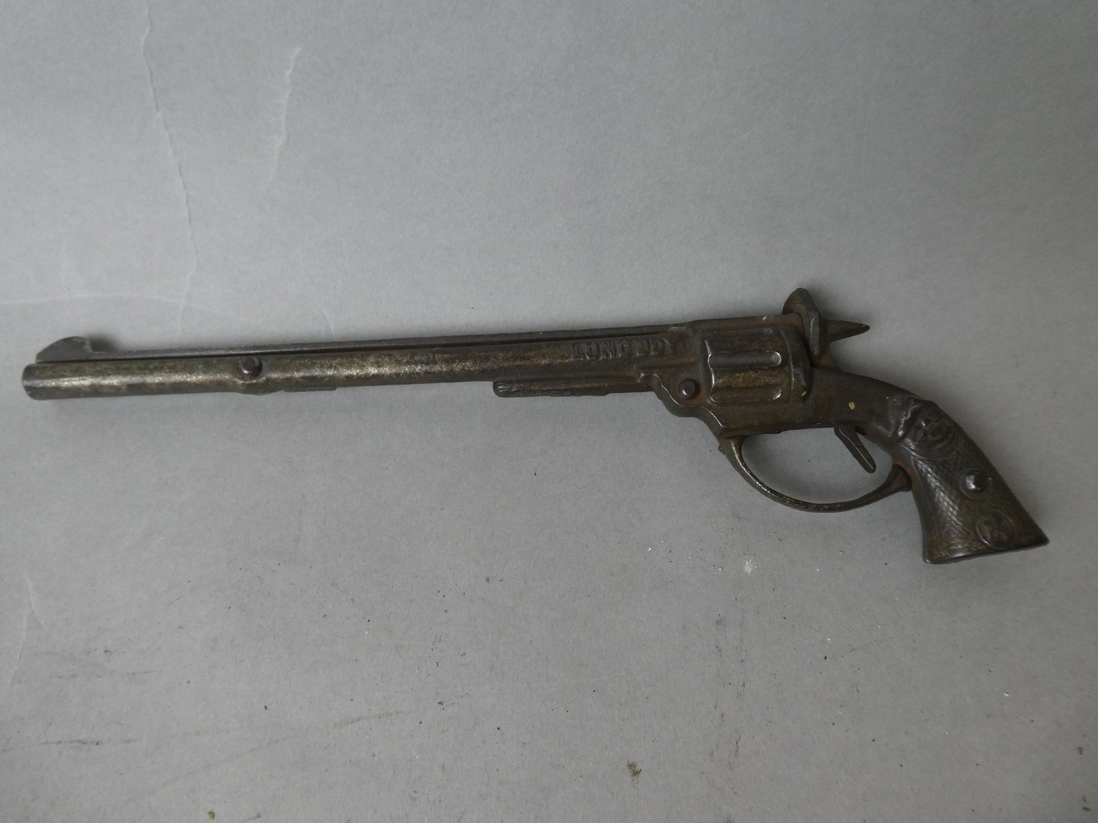 1922 Antique Kilgore Cast Iron Longboy Cap Gun: 1922 Antique Kilgore Cast Iron Longboy Cap Gun. Measurements in inches: 11 long Condition:Normal wear with age and use Shipping:We offer in-house shipping. Item(s) will be packed after invoice is paid