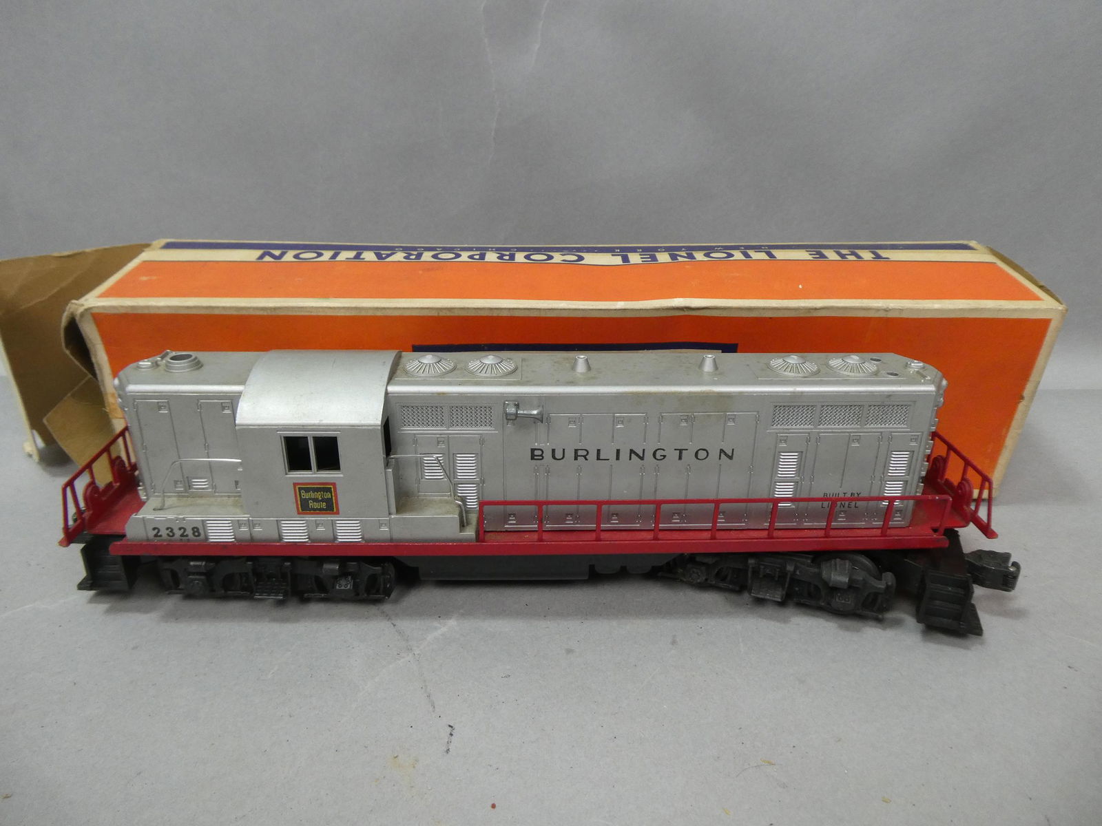 Lionel No 2328 Diesel Locomotive Engine in Box: Lionel No 2328 Diesel Locomotive Engine in Box. Condition:Shows wear with age and use, not tested Shipping:We offer in-house shipping. Item(s) will be packed after invoice is paid and shipping charge