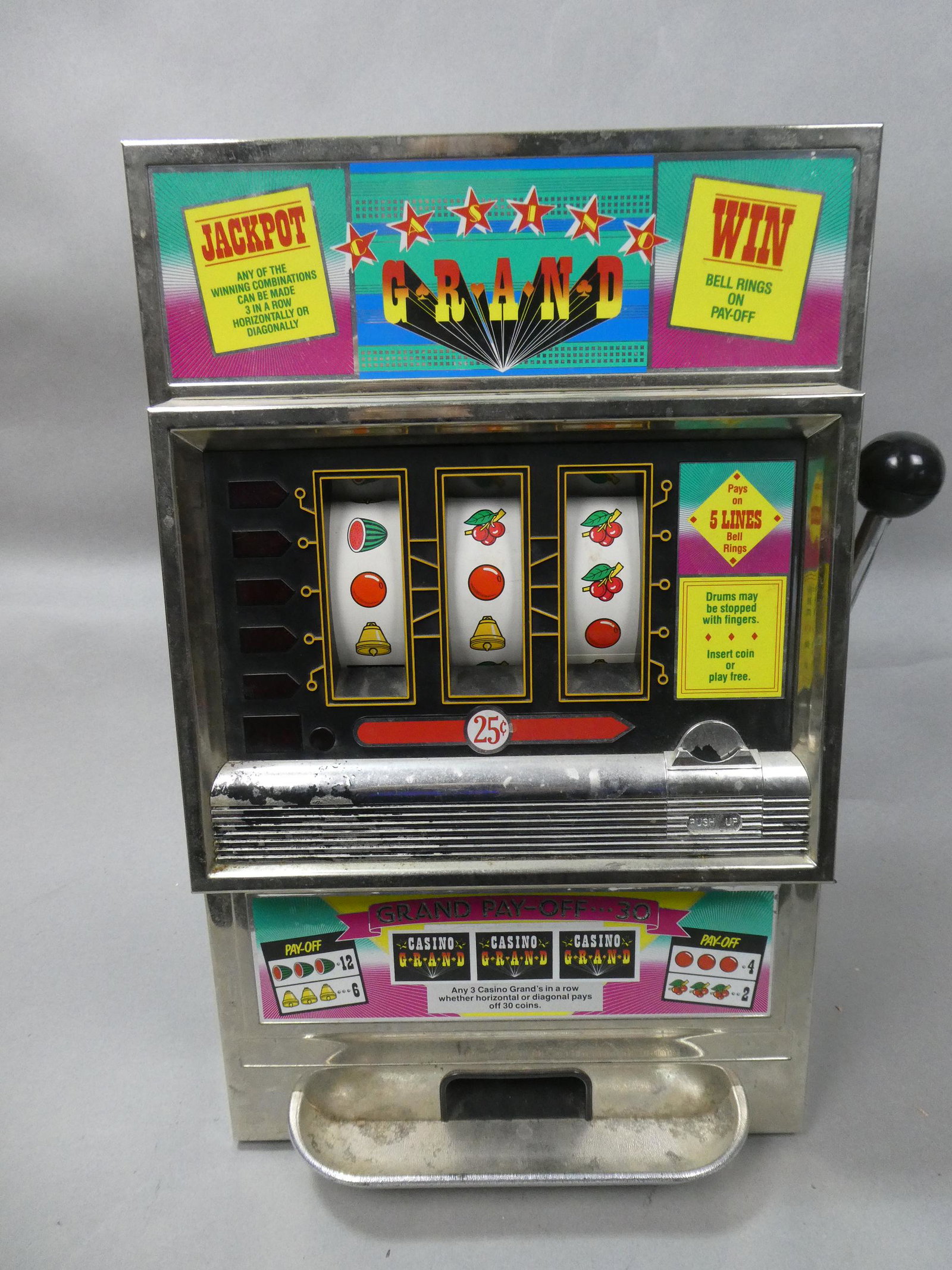 Vintage Japan Grand Toy Slot Machine: Vintage Japan Grand Toy Slot Machine. Measurements in inches: 20 high x 13 x 11 Condition:Used, Works fine in free play Shipping:We offer in-house shipping. Item(s) will be packed after invoice is pai