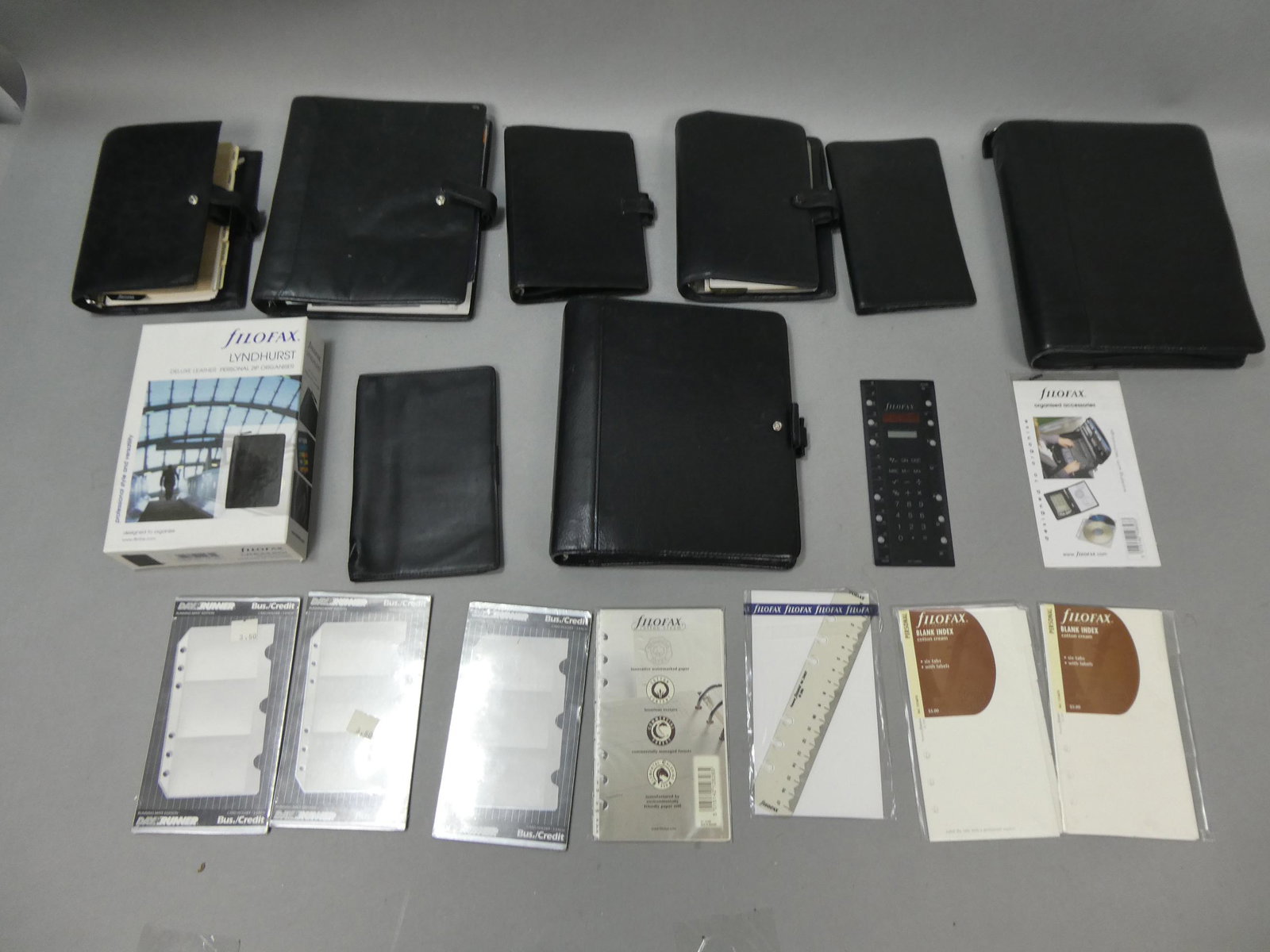 Lot 9 Filofax Black Leather Planners Organizer Binders & More: Lot 9 Filofax Black Leather Planners Organizer Binders along with index cards, calculator and more. Condition:Mild used condition Shipping:We offer in-house shipping. Item(s) will be packed after invo
