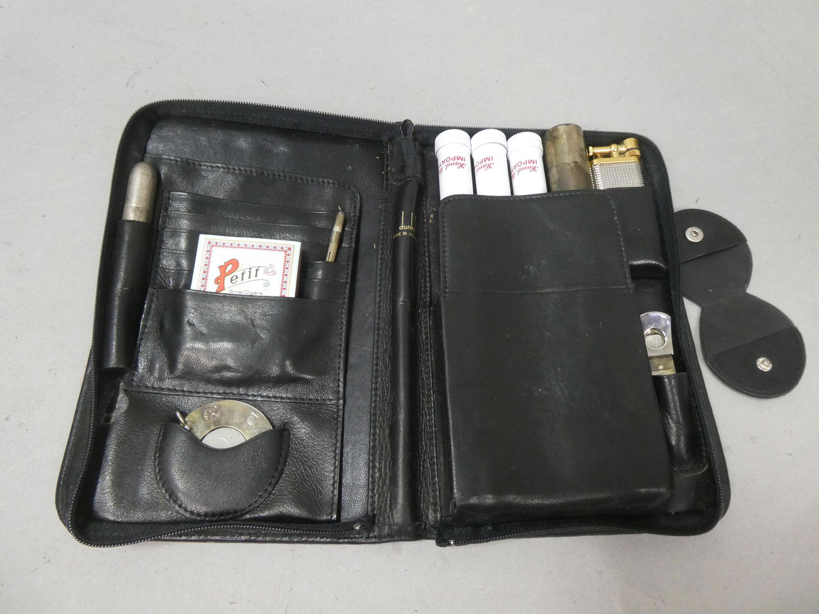 Vintage Dunhill Cigar Sterling Silver Set Cutter etc: Vintage Dunhill Cigar Sterling Silver set in black leather case. Includes sterling cutters, holder and more. With 426576 lighter. Condition:Not sure if complete. Wear commiserate with age Shipping:We
