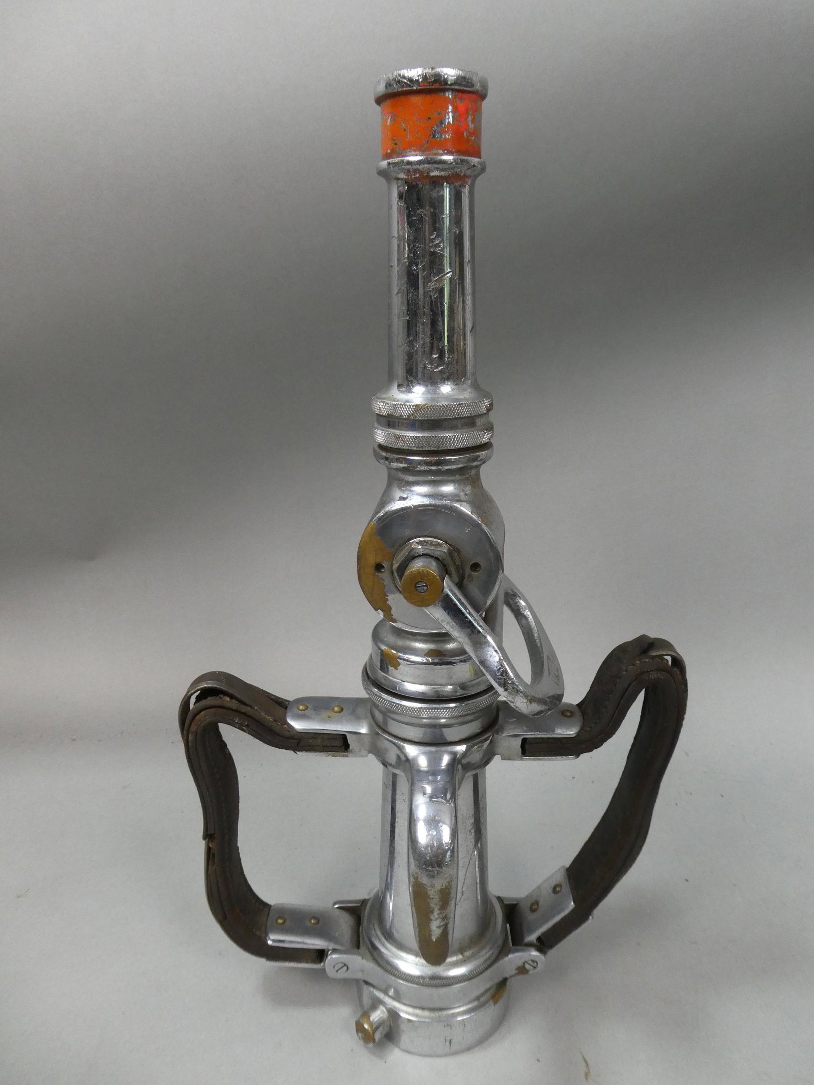 Vintage Nickel Plated Brass Colt Fire Hose Nozzle w/ Leather Handles: Vintage Nickel Plated Brass Colt Fire Hose Nozzle w/ Leather Handles. Measurements in inches: 19 high Condition:Shows wear with age and splitting to the leather Shipping:We offer in-house shipping. It