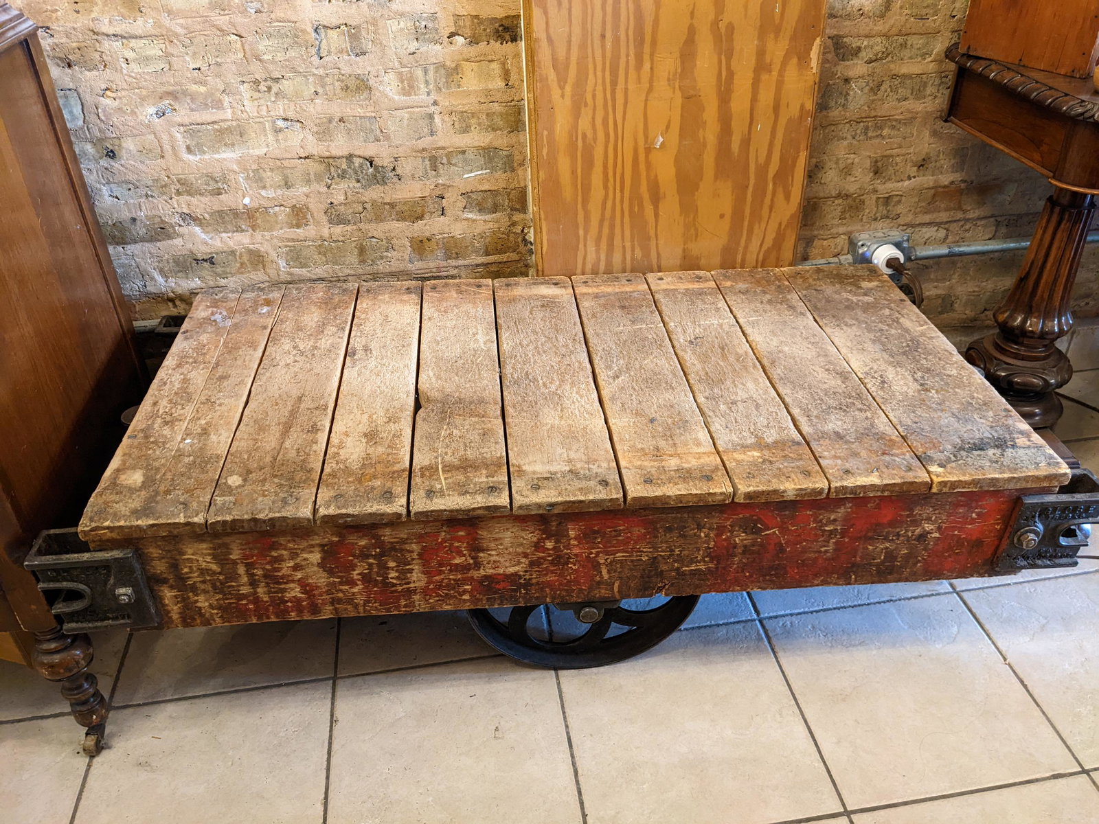 Early 20th Century Wood & Industrial Cart w/ Cast Iron: Early 20th Century Wood & Industrial Cart w/ Cast Iron wheels by the Globe Truck co, would work great as a coffee table. Buyer to arrange pick up or delivery from Chicago, IL. Measurements in inches: