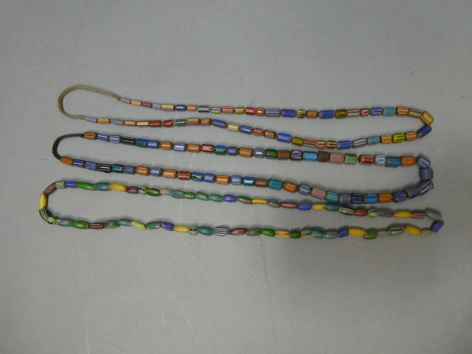 Lot 3 Antique African Trade Tubular Venetian Glass Multi-Color Beaded Necklaces: Lot 3 Antique African Trade Tubular Venetian Glass Multi-Color Beaded Necklaces. Measurements in inches: 26 long each Condition:Normal wear with age and use Shipping:We offer in-house shipping. Item(s