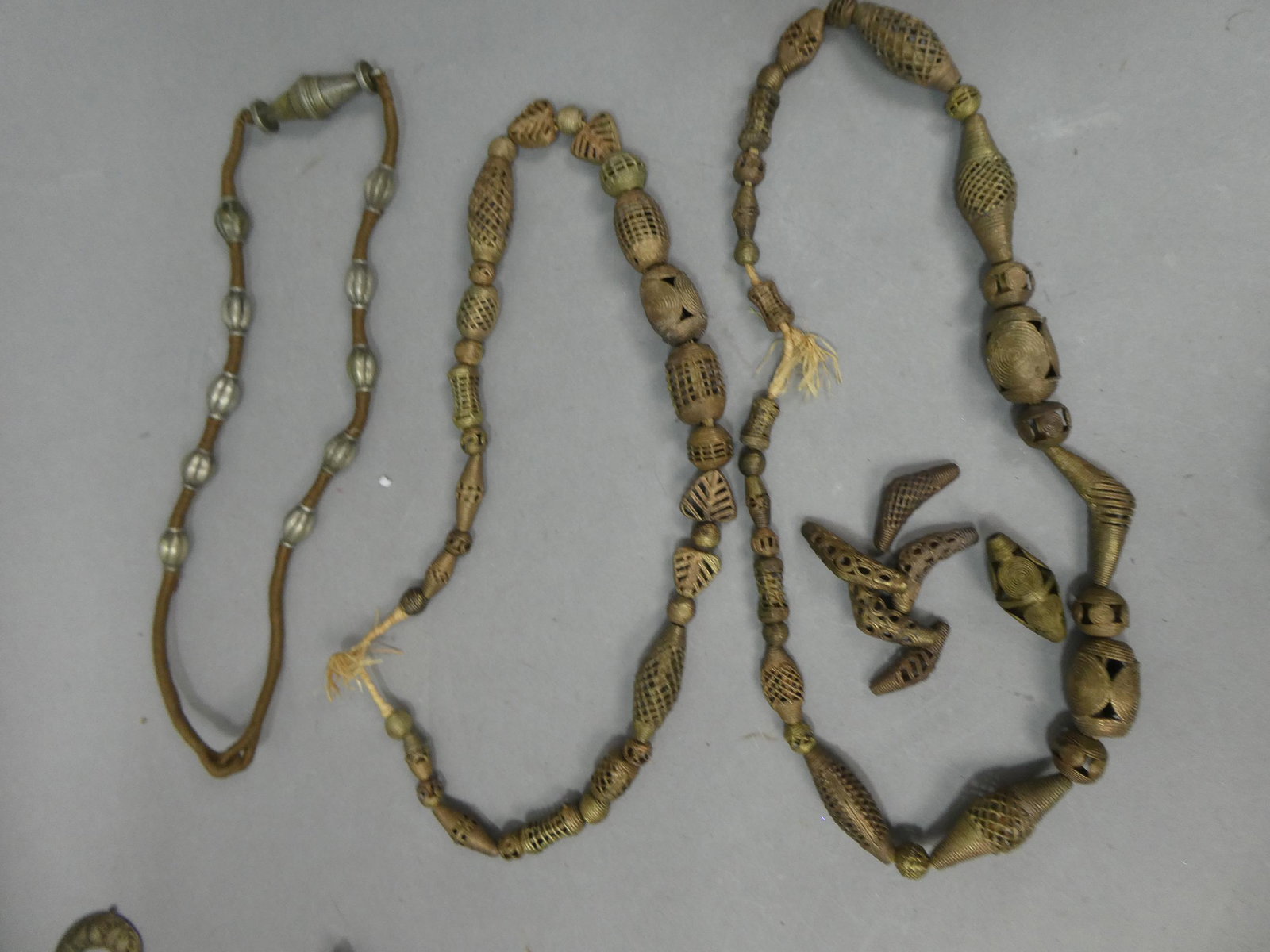 Lot 3 Antique African Brass Metal Filigree Beaded Necklaces: Lot 3 Antique African Brass Metal Filigree Beaded Necklaces, with some loose beads. Measurements in inches: 24, 26 and 28 long Condition:Normal wear with age and use Shipping:We offer in-house shippin