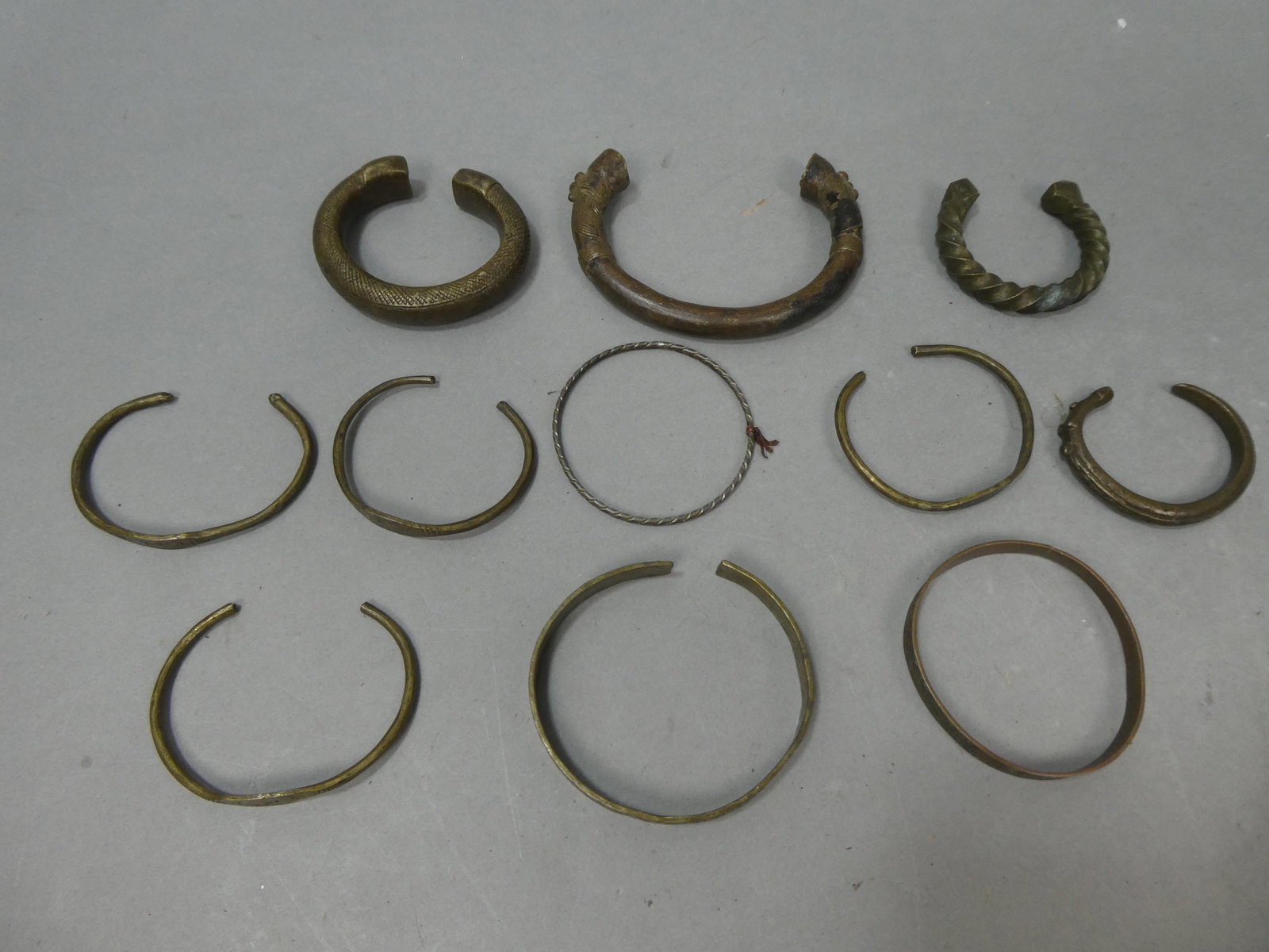 Lot 9 Antique African Brass Assorted Carved Bangle Bracelets: Lot 9 Antique African Brass Assorted Carved Bangle Bracelets. Condition:Normal wear with age and use Shipping:We offer in-house shipping. Item(s) will be packed after invoice is paid and shipping char