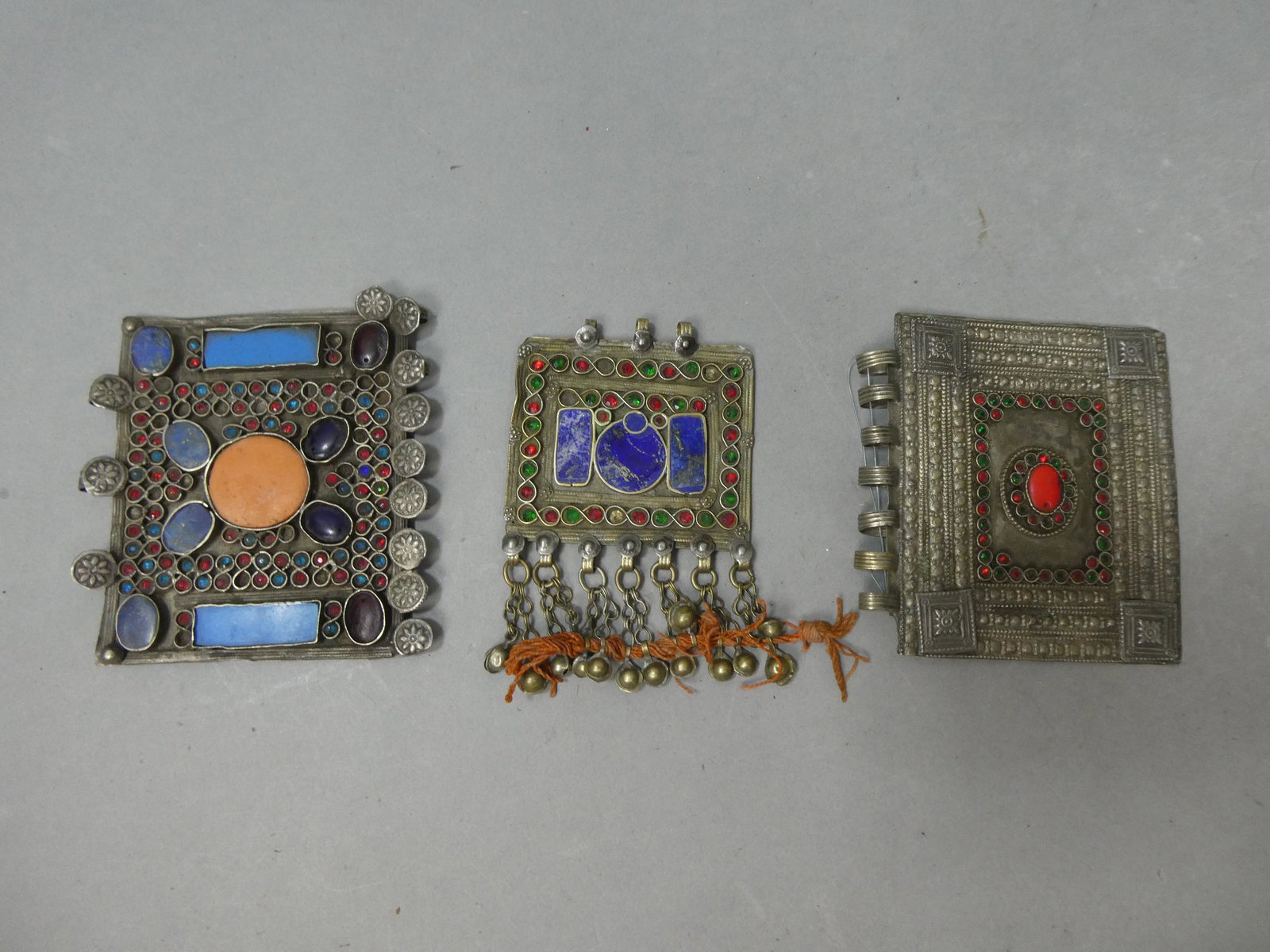 Lot 3 Antique African Tribal Yemini Brass Jeweled Pendants: Lot 3 Antique African Tribal Yemini Brass Jeweled Pendants. Measurements in inches: 4 1/4 x 3 1/2, 4 x 3 and 4 x 4 3/4 Condition:Normal wear with age and use Shipping:We offer in-house shipping. Item(