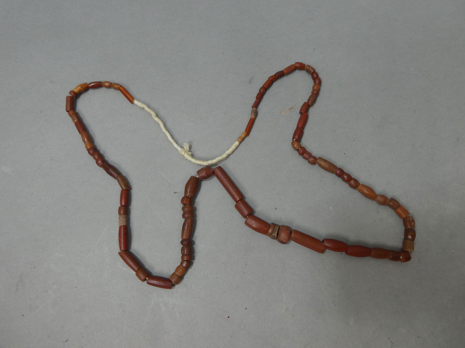 Neolithic African Bauxite Carnelian Jasper Beaded Necklace: Neolithic African Bauxite Carnelian Jasper Beaded Necklace. Measurements in inches: 35 long Condition:Normal wear with age and use Shipping:We offer in-house shipping. Item(s) will be packed after inv