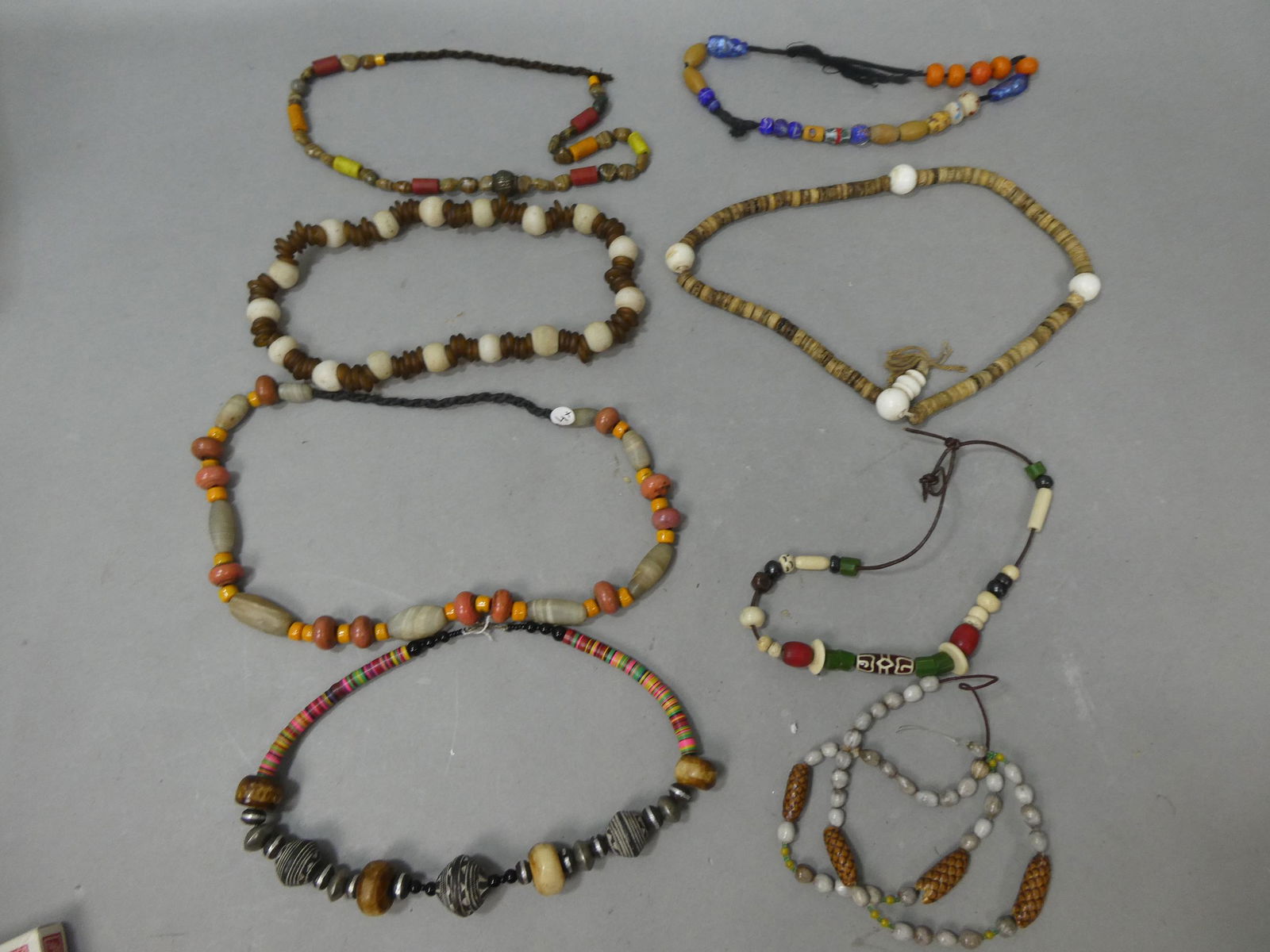 Lot 8 Early African Trade Assorted Necklaces Glass Bone Metal Shell etc: Lot 8 Early African Trade Assorted Necklaces Glass Bone Metal Shell etc. Condition:Normal wear with age and use Shipping:We offer in-house shipping. Item(s) will be packed after invoice is paid and sh