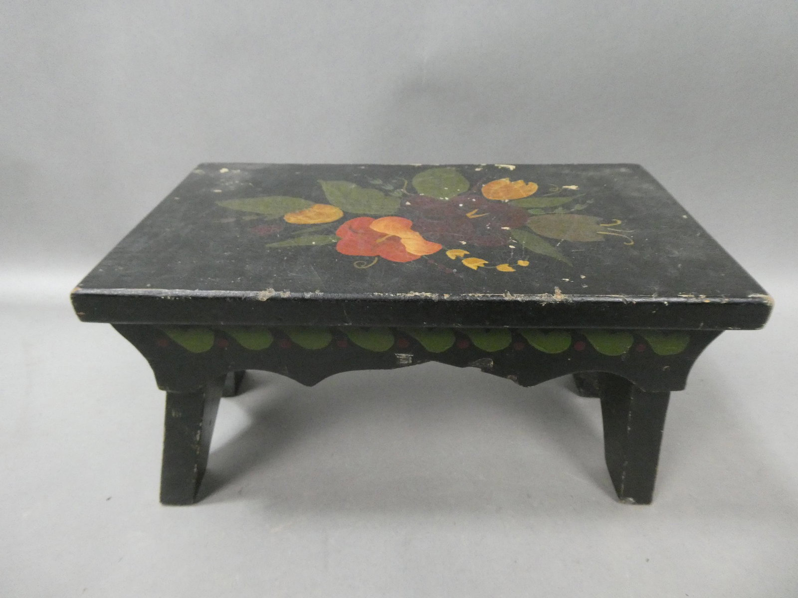 Antique Primitive Black Painted Floral Foot Stool: Antique Primitive Black Painted Floral Foot Stool. Measurements in inches: 7 high x 12 x 7 Condition:Normal wear with age and use Shipping:We offer in-house shipping. Item(s) will be packed after invo