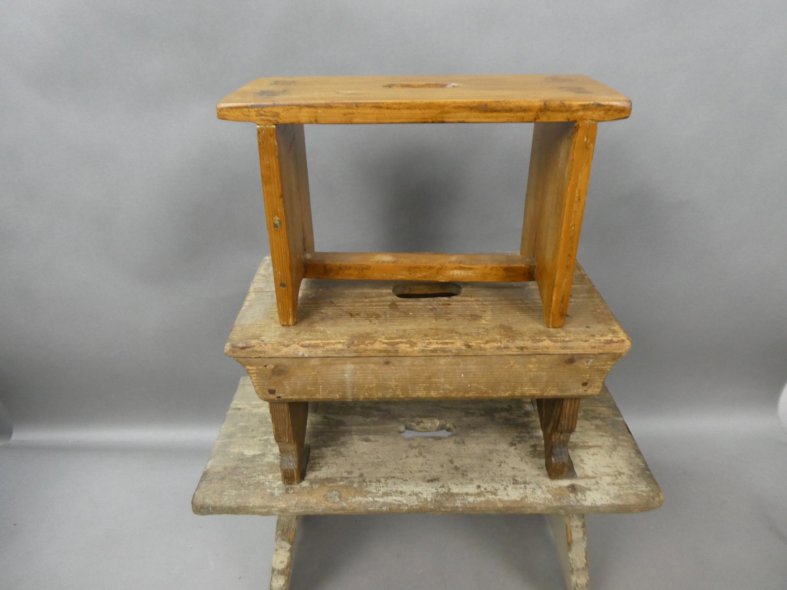 Lot 3 Antique Primitive Foot Stools Plant Stands: Lot 3 Antique Primitive Foot Stools Plant Stands. Measurements in inches: 8 1/2 high x 13 x 5 1/2 and 7 1/2 high x 14 1/2 x 8 and 9 high 20 x 8 Condition:Normal wear with age and use Shipping:We offer