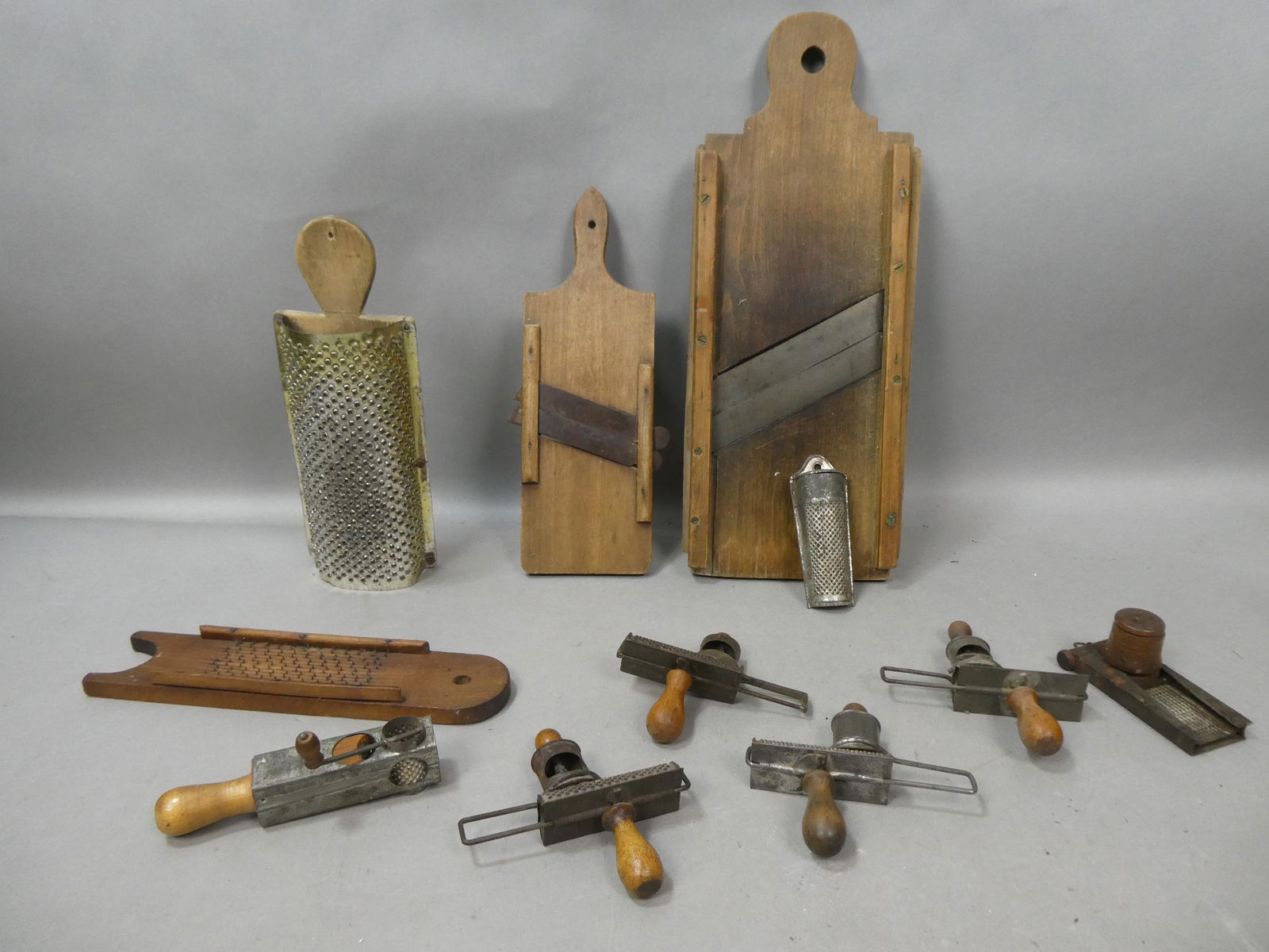 Lot 11 Antique Primitive Kitchen Cheese Nut Graters & Slicers: Lot 11 Antique Primitive Kitchen Cheese Nut Graters & Slicers. Condition:Normal wear with age and use Shipping:We offer in-house shipping. Item(s) will be packed after invoice is paid and shipping cha