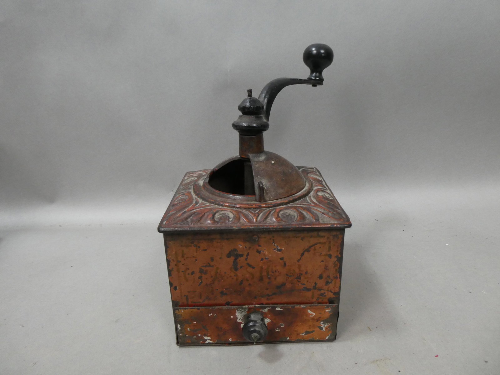 Antique Primitive Painted Tin & Cast Iron Coffee Grinder: Antique Primitive Painted Tin & Cast Iron Coffee Grinder. Measurements in inches: 9 high x 6 square Condition:Normal wear with age and use Shipping:We offer in-house shipping. Item(s) will be packed a