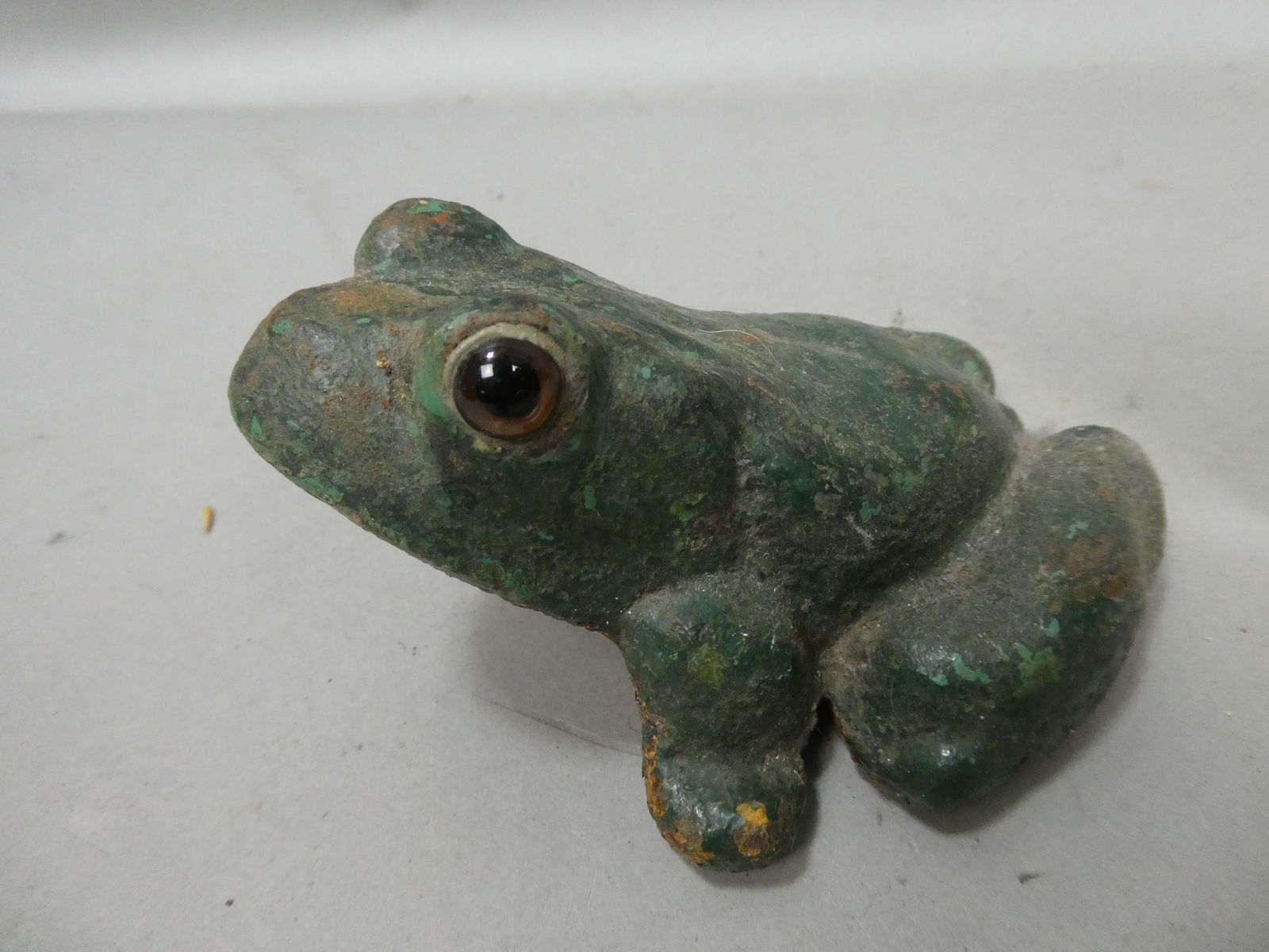 Antique Primitive Cast Iron Frog Door Stop w/ Glass Eyes: Antique Primitive Cast Iron Frog Door Stop w/ Glass Eyes. Measurements in inches: 5 1/2 long Condition:Normal wear with age and use Shipping:We offer in-house shipping. Item(s) will be packed after in