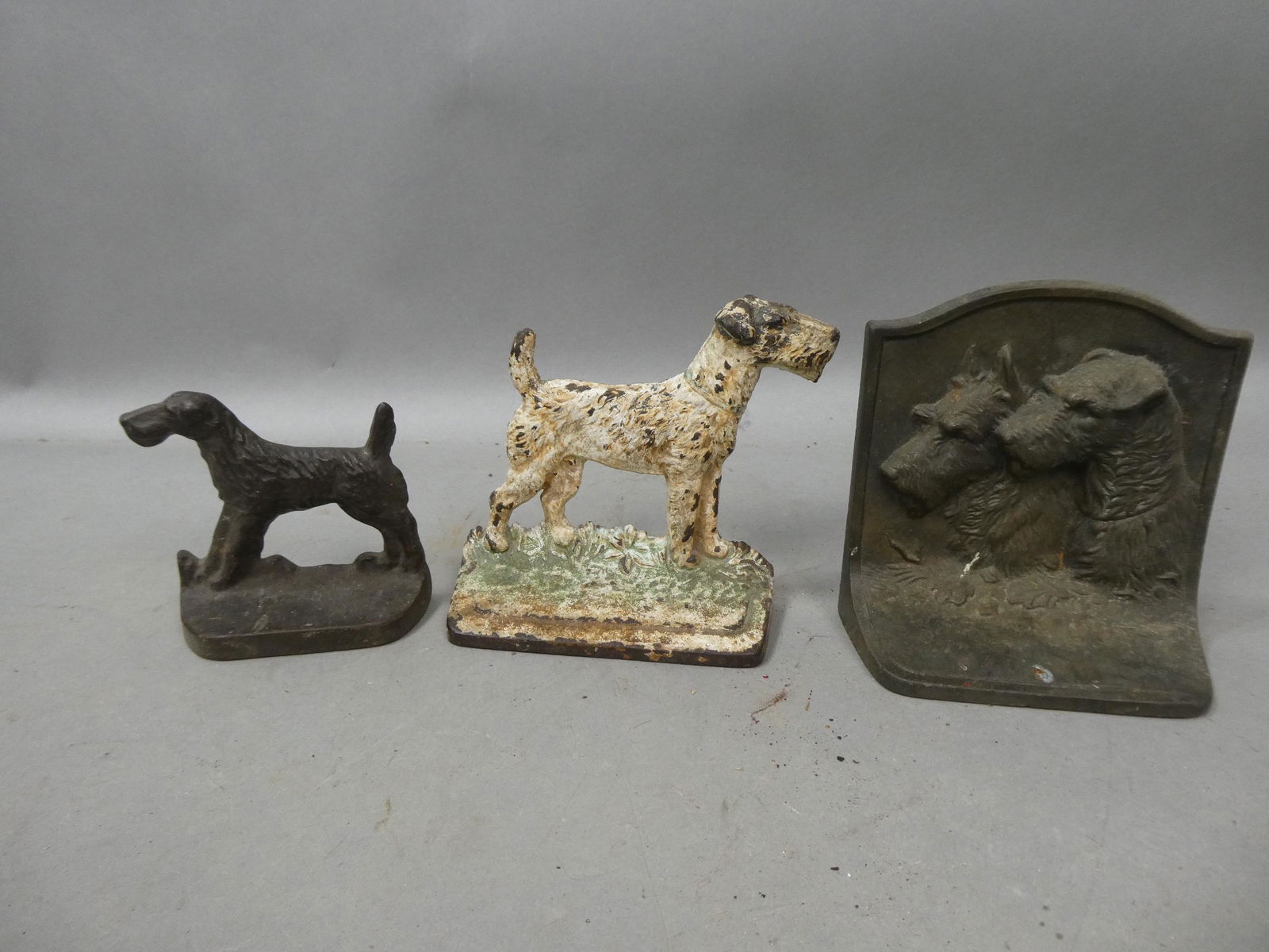 Lot 3 Antique Cast Iron Boston Terrier Door Stop or Bookends: Lot 3 Antique Cast Iron Boston Terrier Door Stop or Bookends. Condition:Normal wear with age and use Shipping:We offer in-house shipping. Item(s) will be packed after invoice is paid and shipping char