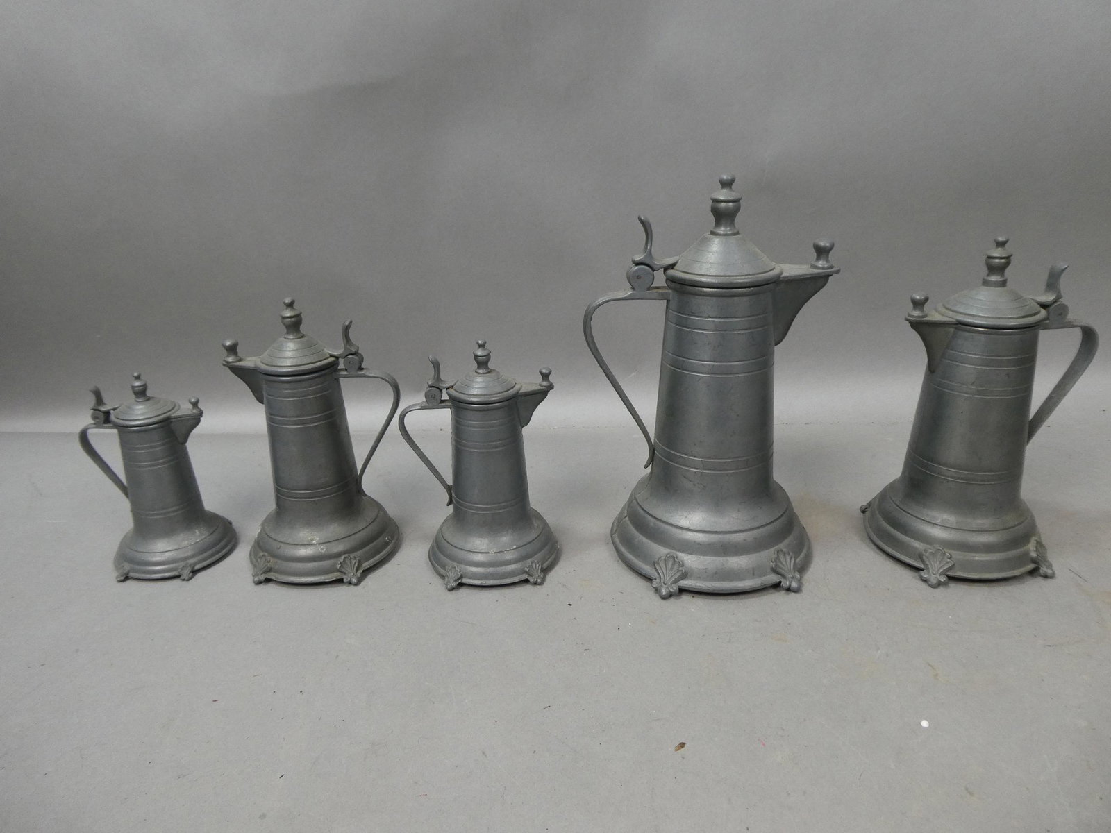 Set 5 Antique Marked Pewter Assorted Size Tankards Flagons: Set 5 Antique Marked Pewter Assorted Size Tankards Flagons. Measurements in inches: 4 to 10 high Condition:Mild wear with age and use Shipping:We offer in-house shipping. Item(s) will be packed after 