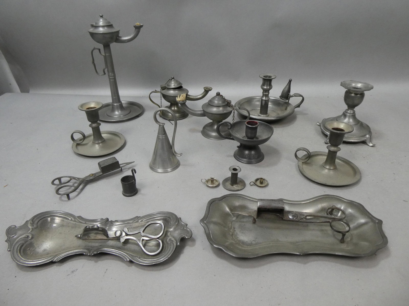 Large Lot Antique Pewter Candle Holders Snuffers & Oil Lamps: Large Lot Antique Pewter Candle Holders Snuffers & Oil Lamps. Condition:As found, sold as is Shipping:We offer in-house shipping. Item(s) will be packed after invoice is paid and shipping charge will 