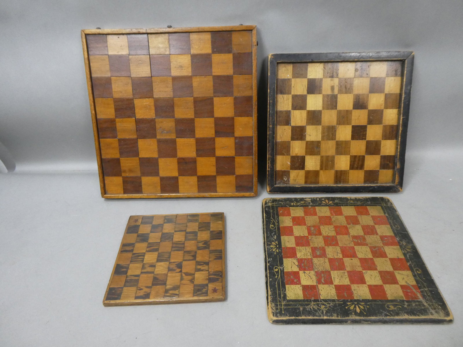Lot 4 Antique Primitive Wooden Handmade Checkerboard Game Board: Lot 4 Antique Primitive Wooden Handmade Checkerboard Game Board. Measurements in inches: 8 1/2, 12, 12 1/2 and 15 square Condition:As found, sold as is Shipping:We offer in-house shipping. Item(s) wil