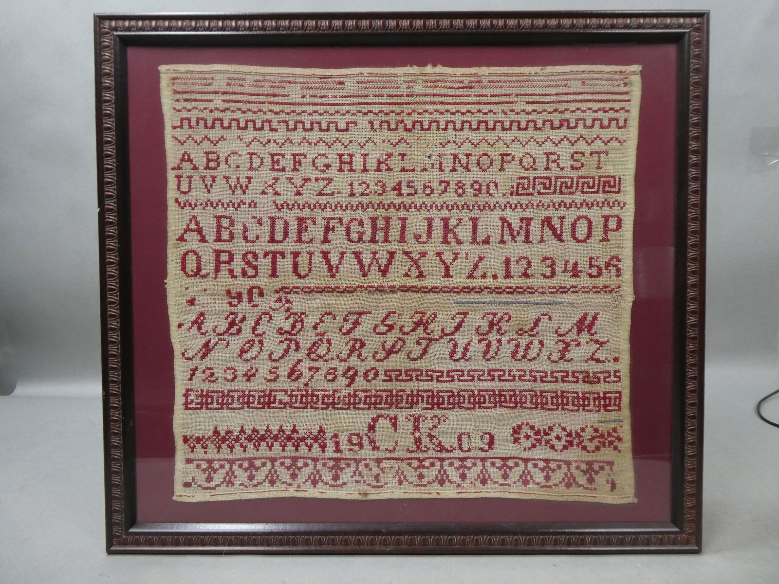1909 Antique Needlepoint Framed ABC School Sampler: 1909 Antique Needlepoint Framed ABC School Sampler. Measurements in inches: 22 x 20 1/2, image: 17 x 16 Condition:Well worn with age and use Shipping:We offer in-house shipping. Item(s) will be packed