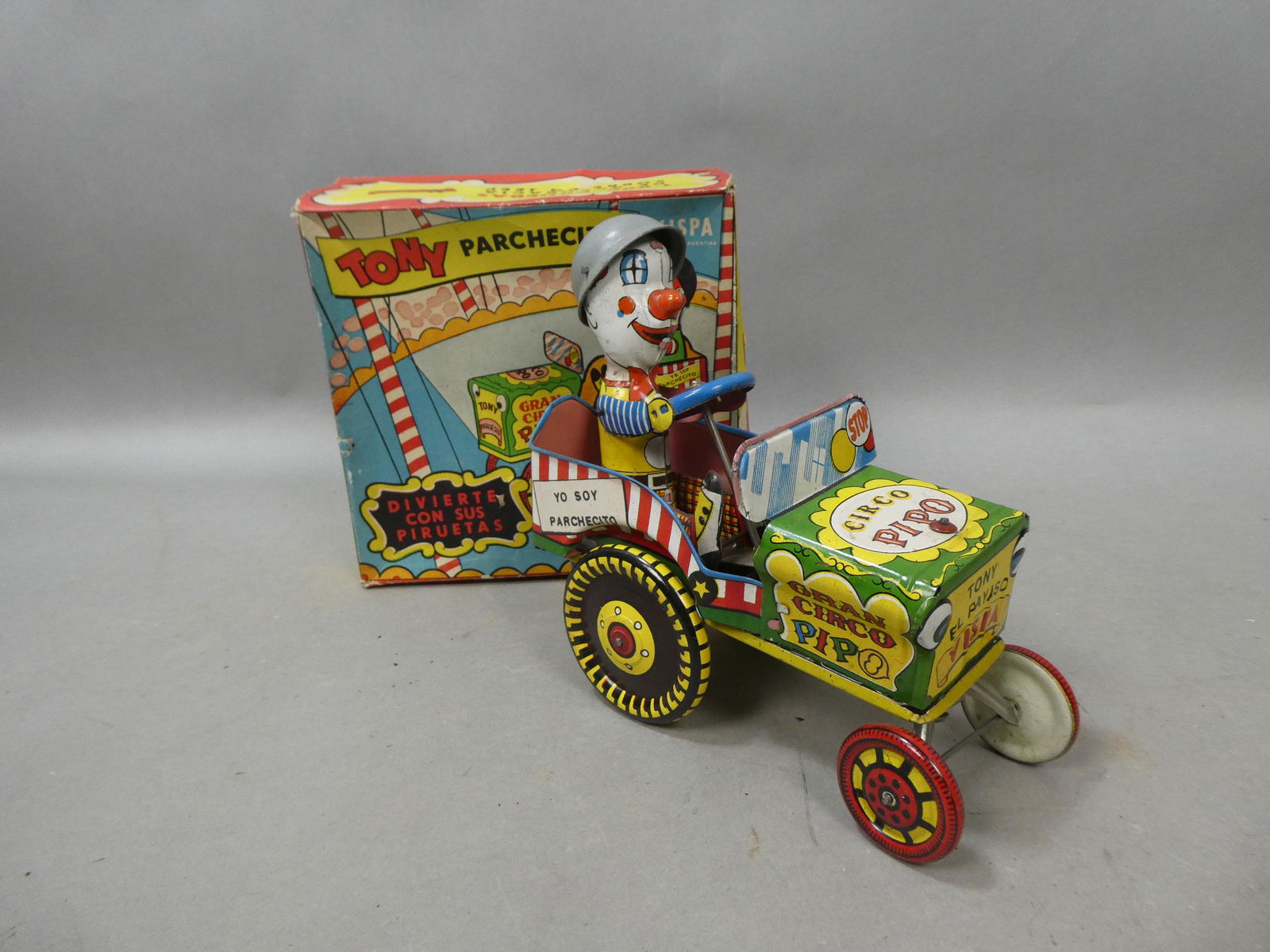 1950's Halcon Tony Parchecito Vispa Cico Pipo Tin Wind Up Toy in Box: 1950's Halcon Tony Parchecito Vispa Cico Pipo Tin Wind Up Toy in Box. Measurements in inches: 6 1/2 long Condition:Some wear and tear to box Shipping:We offer in-house shipping. Item(s) will be packed