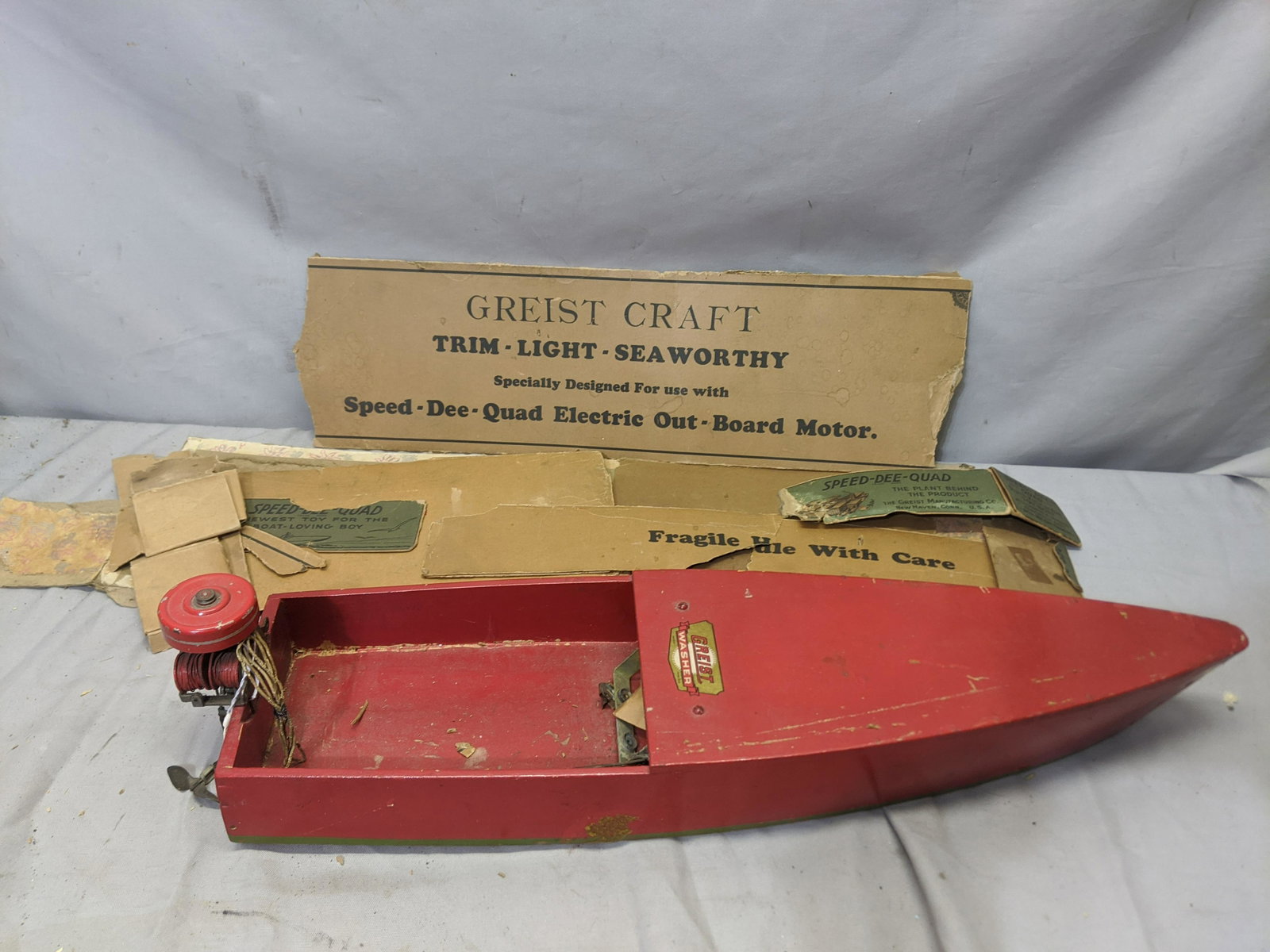 c1930 Speed-Dee-Quad Greist Washer Wood Boat w/ Engine: c1930 Speed-Dee-Quad Greist Washer Wood Boat w/ Engine and parts and pieces of box. Measurements in inches: 24 long Condition:Not tested. Shows some light wear with age and use Shipping:We offer in-ho