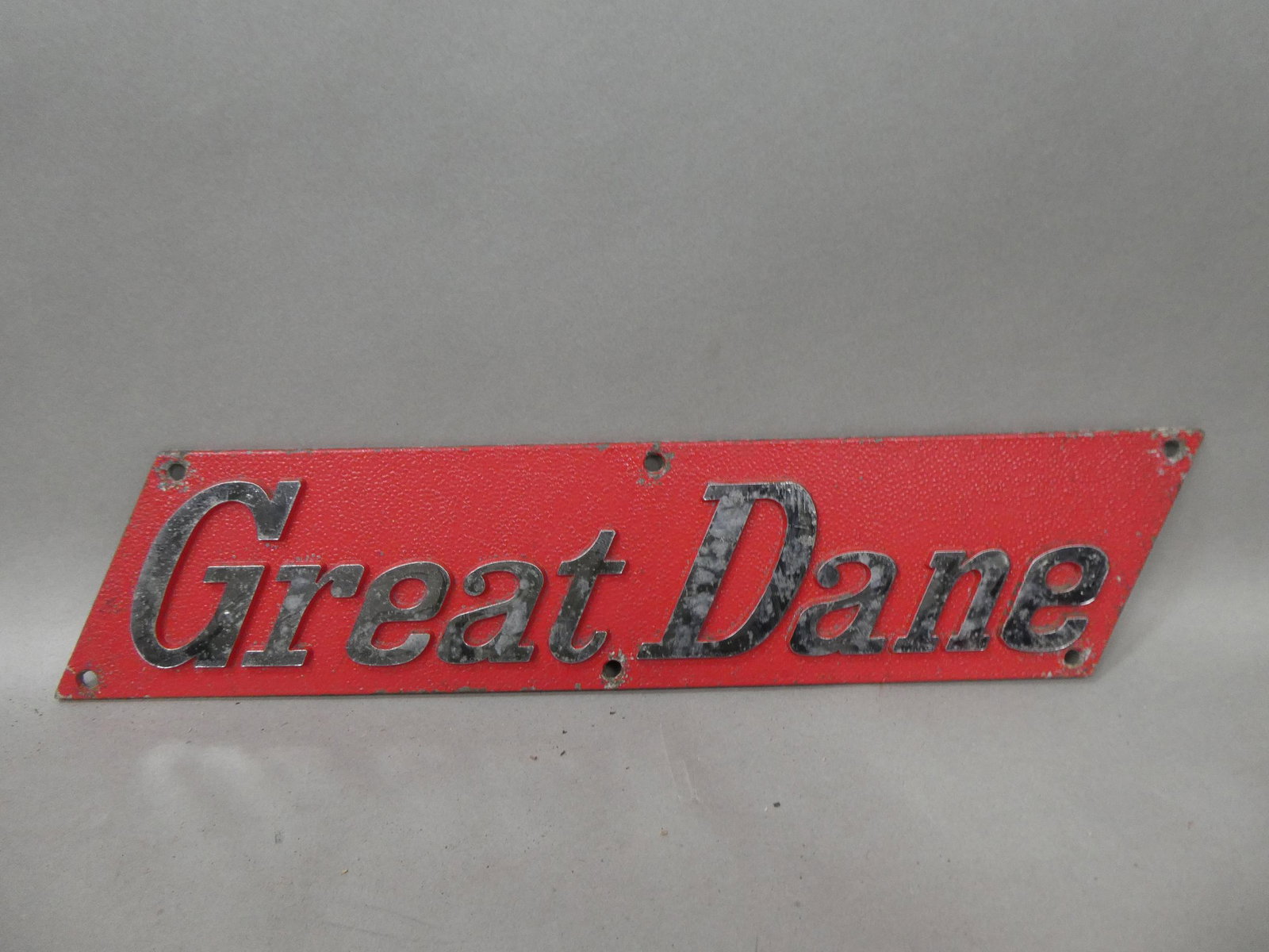 Antique Great Dane Truck Steel Emblem Plate: Antique Great Dane Truck Steel Emblem Plate. Measurements in inches: 16 x 3 1/2 Condition:Minor wear with age and use Shipping:We offer in-house shipping. Item(s) will be packed after invoice is paid 