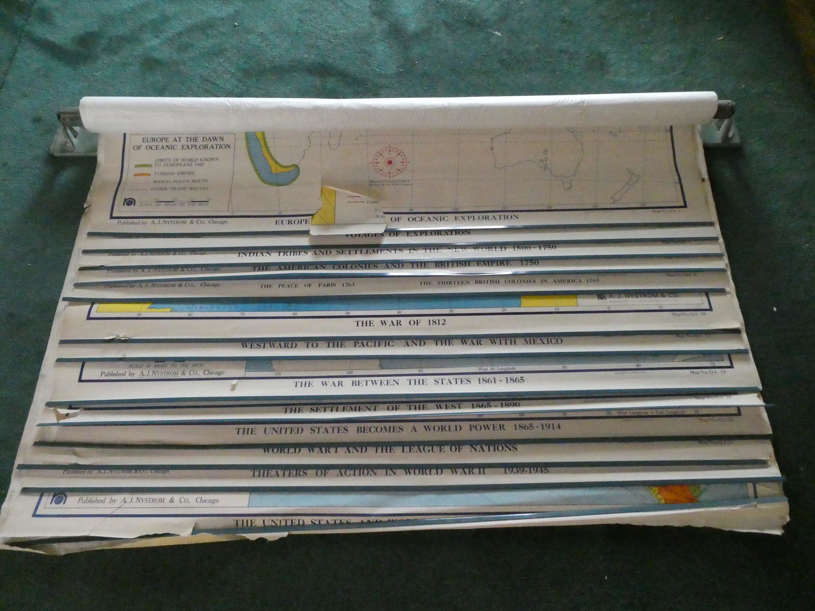 Vintage AJ Nystrom School Pull Down United States History Map: Vintage AJ Nystrom School Pull Down United States History Map with wall bracket and 14 maps. Measurements in inches: 60 across 31 high Condition:Maps have tears. Needs work for mechanism to work again
