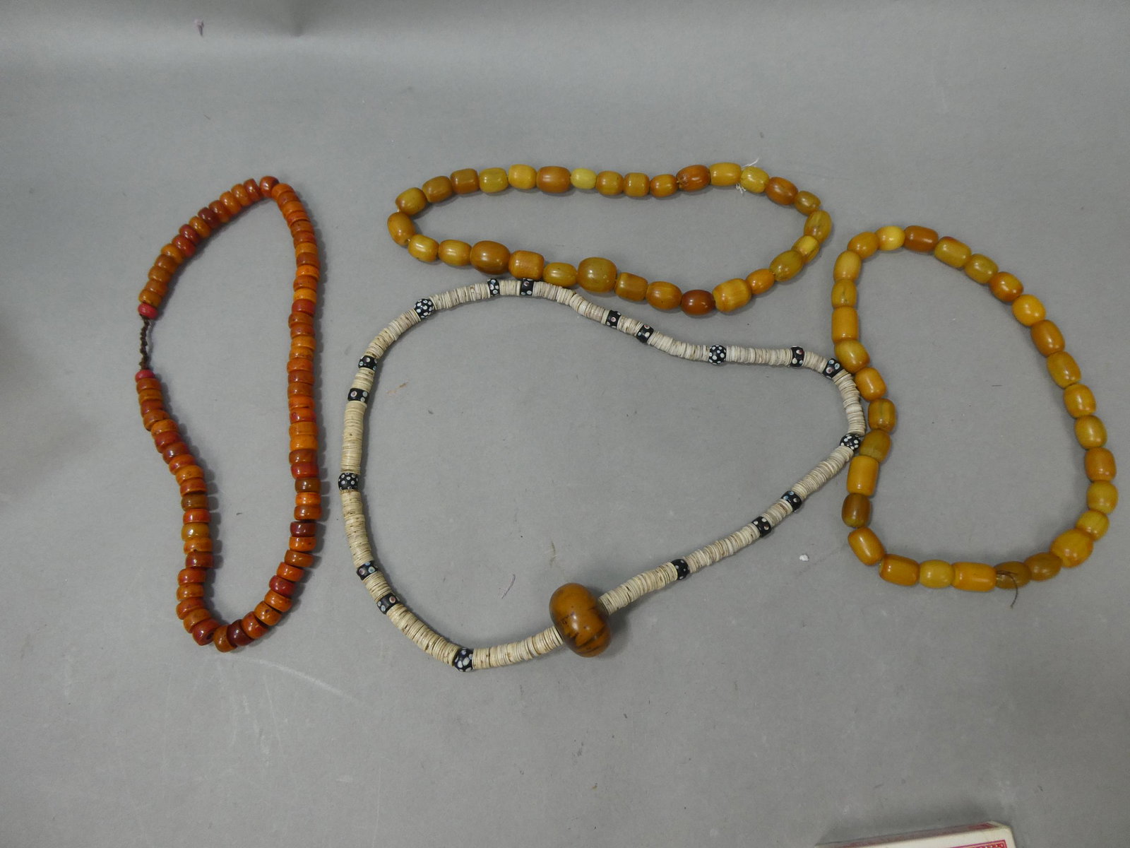 Lot 4 Antique African Trade Amber Glass Necklaces: Lot 4 Antique African Trade Amber Glass Necklaces. Condition:Normal wear with age and use Shipping:We offer in-house shipping. Item(s) will be packed after invoice is paid and shipping charge will be 