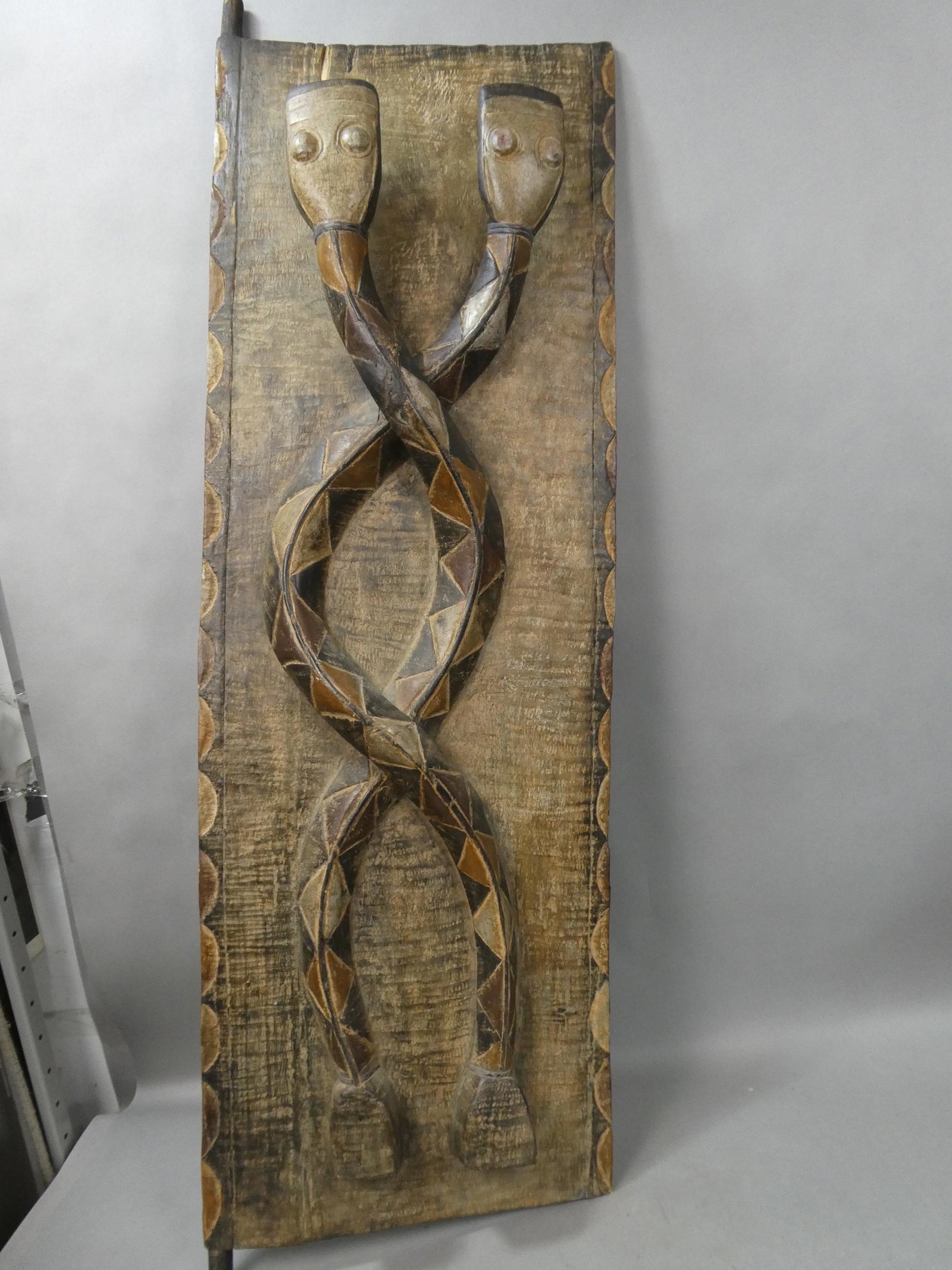 Large African Carved Wood Door Coiled Snakes: Large African Carved Wood Door Coiled Snakes. Measurements in inches: 18 x 58 Condition:Normal wear with age and use Shipping:We offer in-house shipping. Item(s) will be packed after invoice is paid a