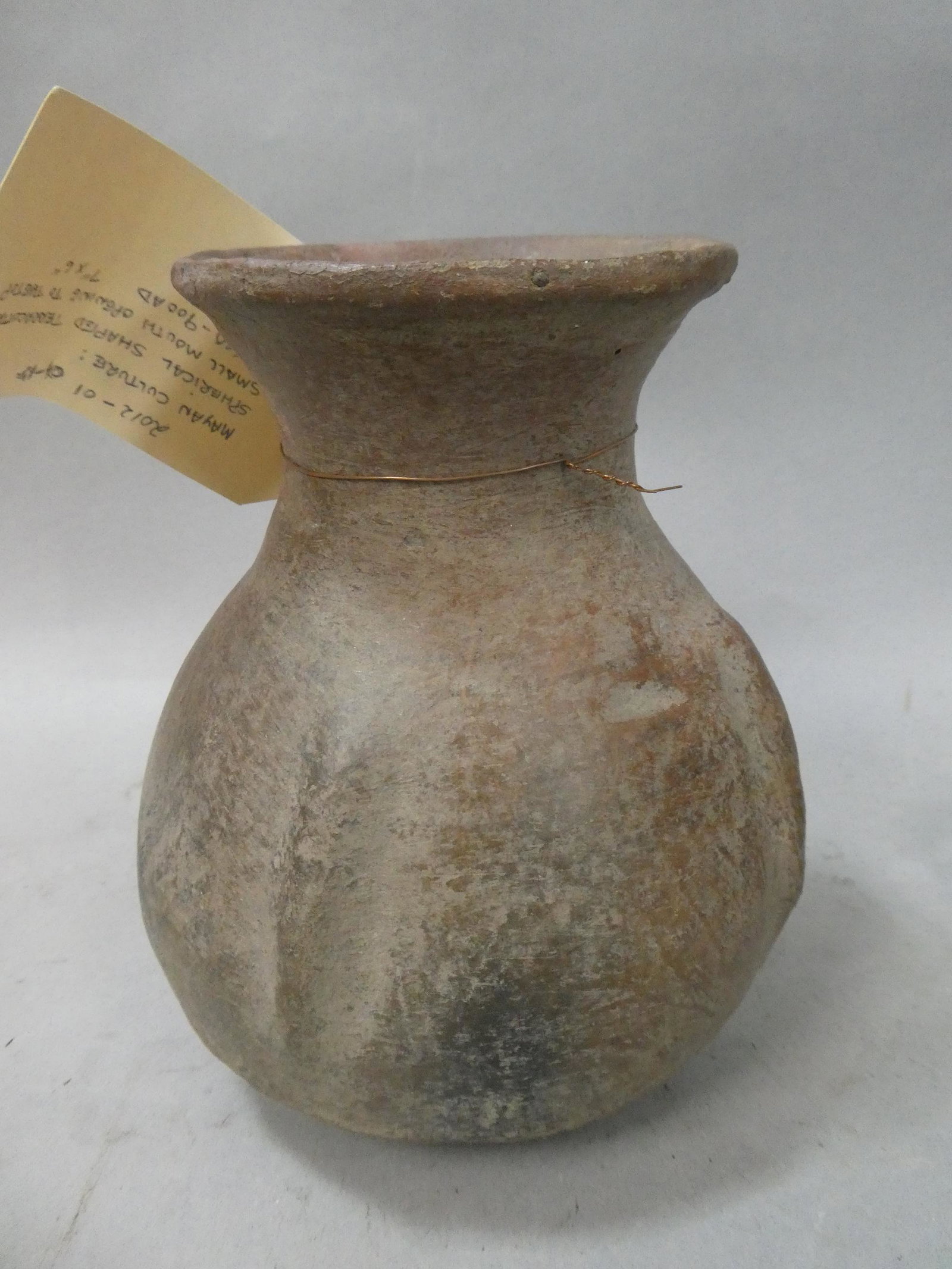 Repro Mayan Culture Spherical Shaped Terra Cotta Vessel Vase: Repro Mayan Culture Spherical Shaped Terra Cotta Vessel Vase. Measurements in inches: 7 high x 6 diameter Condition:Not original, made to look old Shipping:We offer in-house shipping. Item(s) will be 