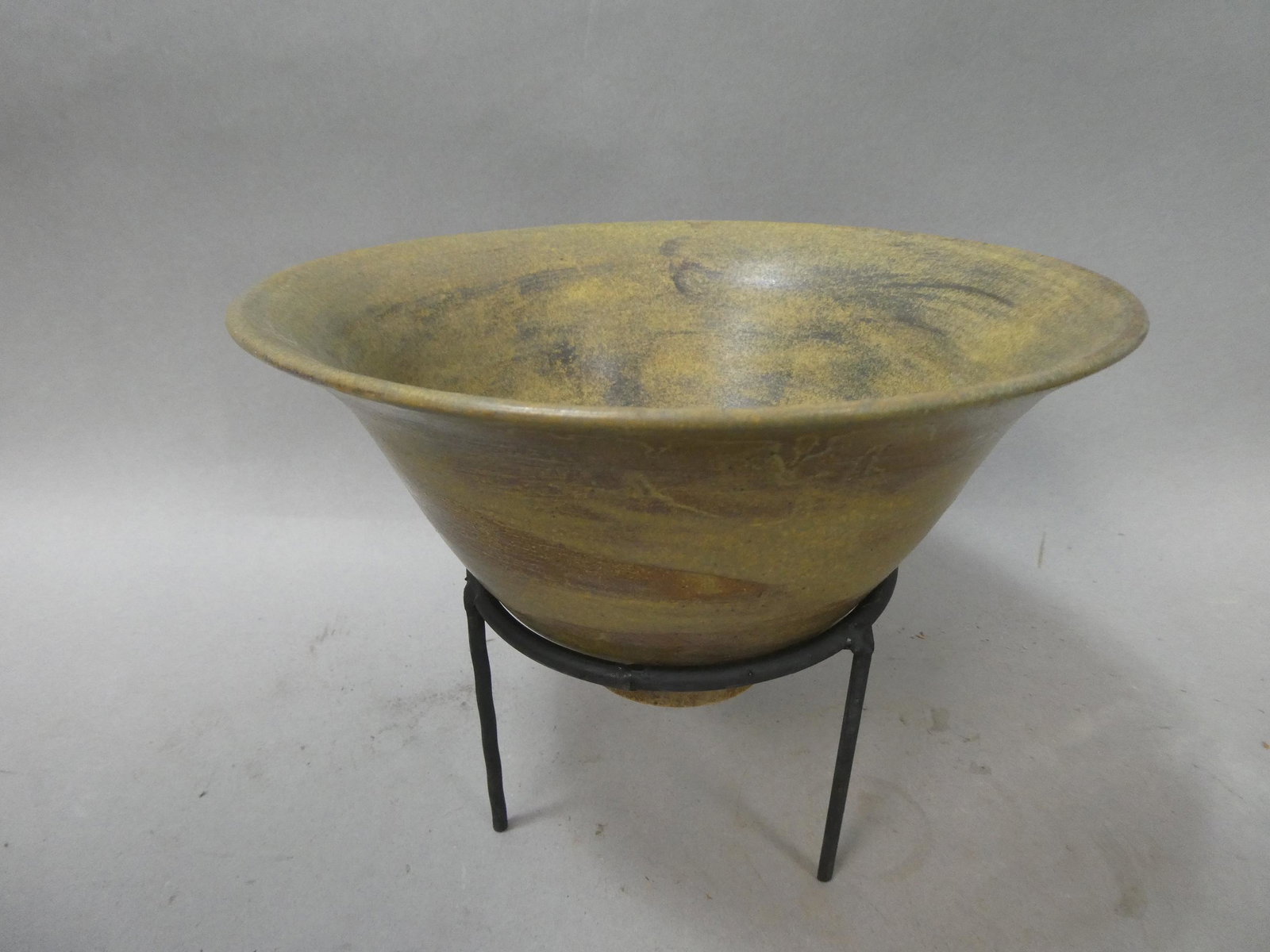 Repro American Indian Wide Mouth Art Pottery Bowl: Repro American Indian Wide Mouth Art Pottery Bowl with stand. Measurements in inches: 5 high x 9 diameter Condition:Not original, made to look old Shipping:We offer in-house shipping. Item(s) will be 