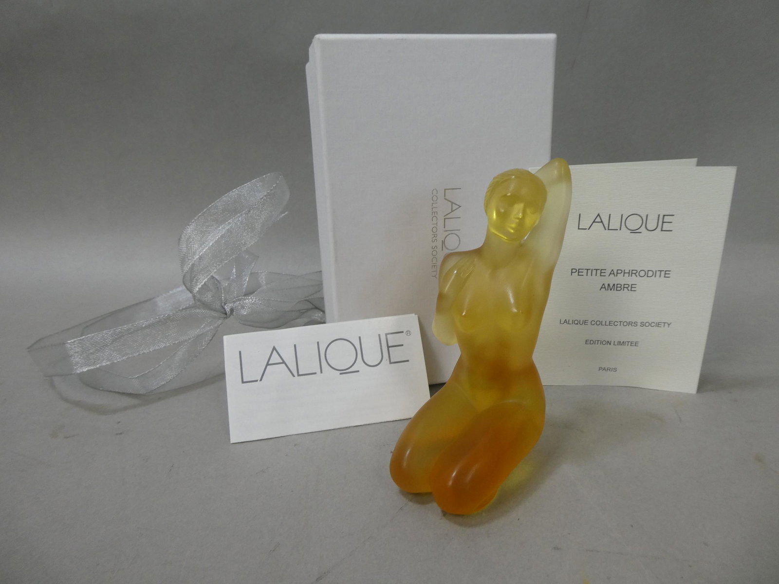 Lalique Ltd Ed Crystal Petite Aphrodite Amber Ambre Nude Woman Figurine: Lalique Crystal Petite Aphrodite Amber Ambre Nude Woman Figurine in box with all papers including certificate of authenticity. Measurements in inches: 5 high Condition:New in box, never displayed Ship