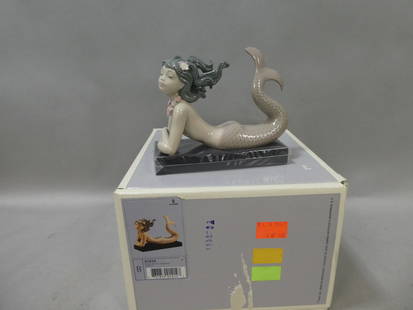 Lladro 1414 Fantasy Mermaid on Base w/ Box: Lladro 1414 Fantasy Mermaid on Base w/ Box. Measurements in inches: 5 high on base Condition:Good with no chips, cracks or repairs Shipping:We offer in-house shipping. Item(s) will be packed after inv