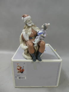 Lladro 5711 A Christmas Wish Figurine in Box Boy on Santa's Lap: Lladro 5711 A Christmas Wish Figurine in Box Boy on Santa's Lap. Measurements in inches: 8 high Condition:Good with no chips, cracks or repairs Shipping:We offer in-house shipping. Item(s) will be pac