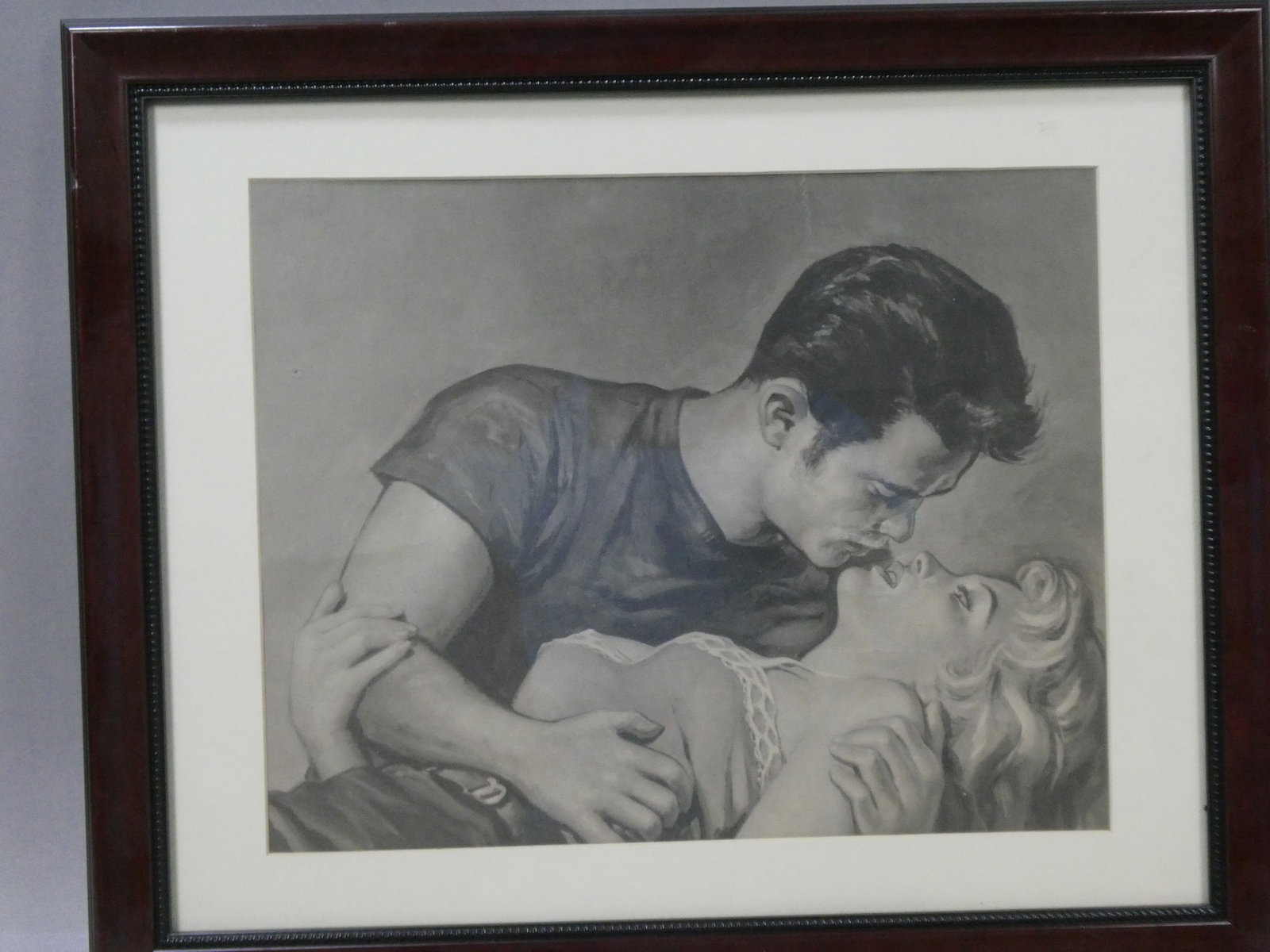 Vintage 1950's Man & Woman Embracing B&W Drawing: Vintage 1950's Man & Woman Embracing B&W Drawing framed under glass. Measurements in inches: 22 1/2 x 18 1/2, image: 16 x 12 Condition:Frame has chipping bottom edge and drawing has tear from top edge