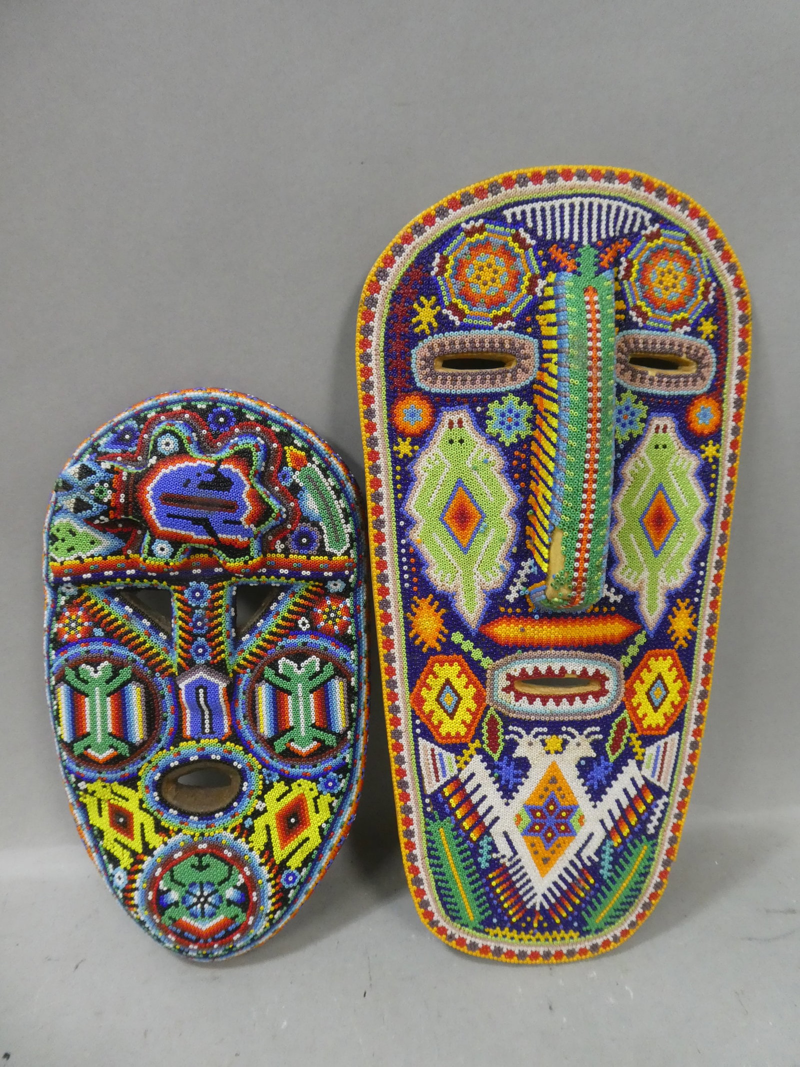 Pair Vintage Carved Wooden Beaded Native American Folk Art Masks: Pair Vintage Carved Wooden Beaded Native American Folk Art Masks. Measurements in inches: 12 and 15 high Condition:Good with no problems Shipping:We offer in-house shipping. Item(s) will be packed aft