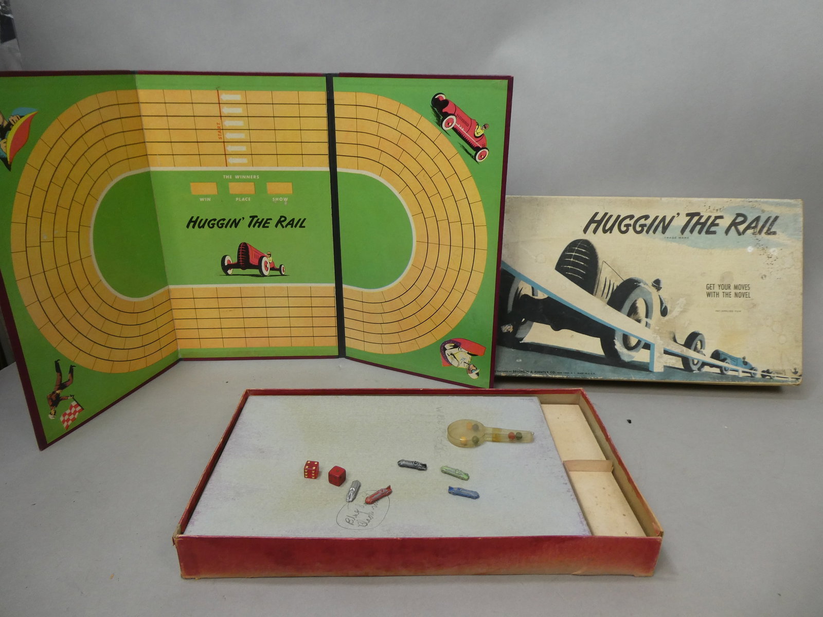 1948 Selchow & Righter Huggin' the Rail Board Game in Box: 1948 Selchow & Righter Huggin' the Rail Board Game in Box. Condition:Box has tear on edge, wear, fading and soiling Shipping:We offer in-house shipping. Item(s) will be packed after invoice is paid an