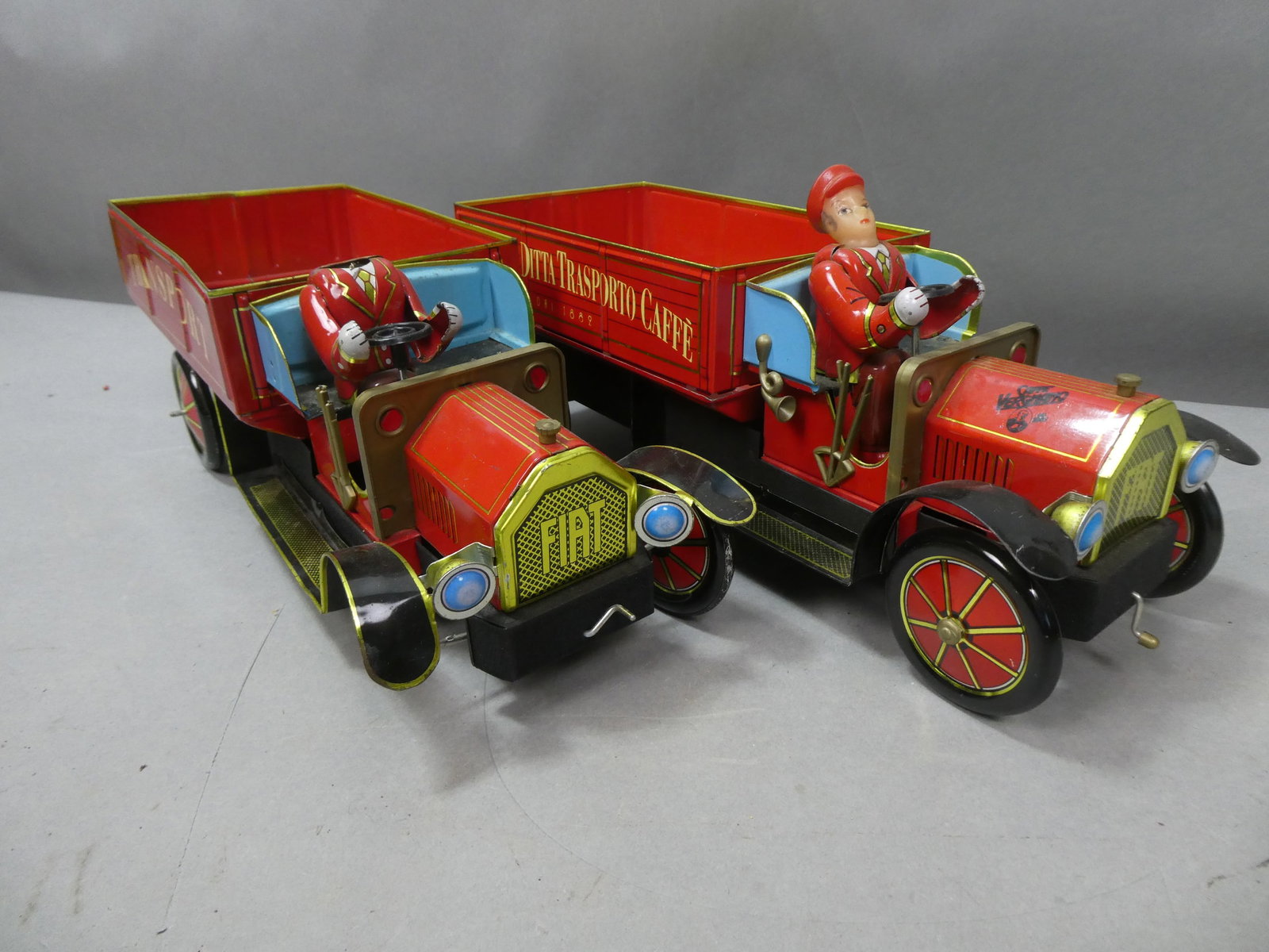 Lot 2 Vintage Made in China Tin Delivery Advert Trucks: Lot 2 Vintage Made in China Tin Delivery Advertising Trucks. Measurements in inches: 13 1/2 long Condition:One missing driver head, wheel and horn Shipping:We offer in-house shipping. Item(s) will be 