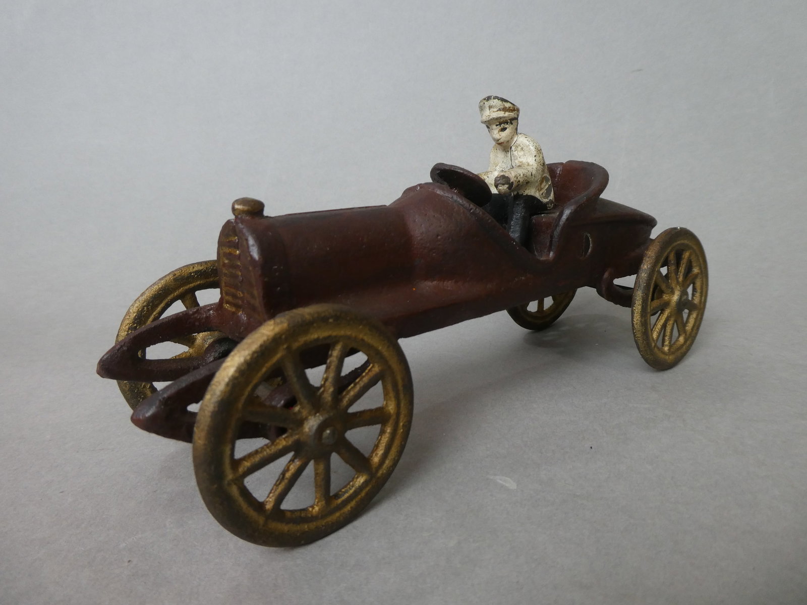 1920's Hubley Cast Iron Racing Car w/ Driver: 1920's Hubley Cast Iron Racing Car w/ Driver. Measurements in inches: 7 1/2 long Condition:Normal wear to original paint with age and use Shipping:We offer in-house shipping. Item(s) will be packed af