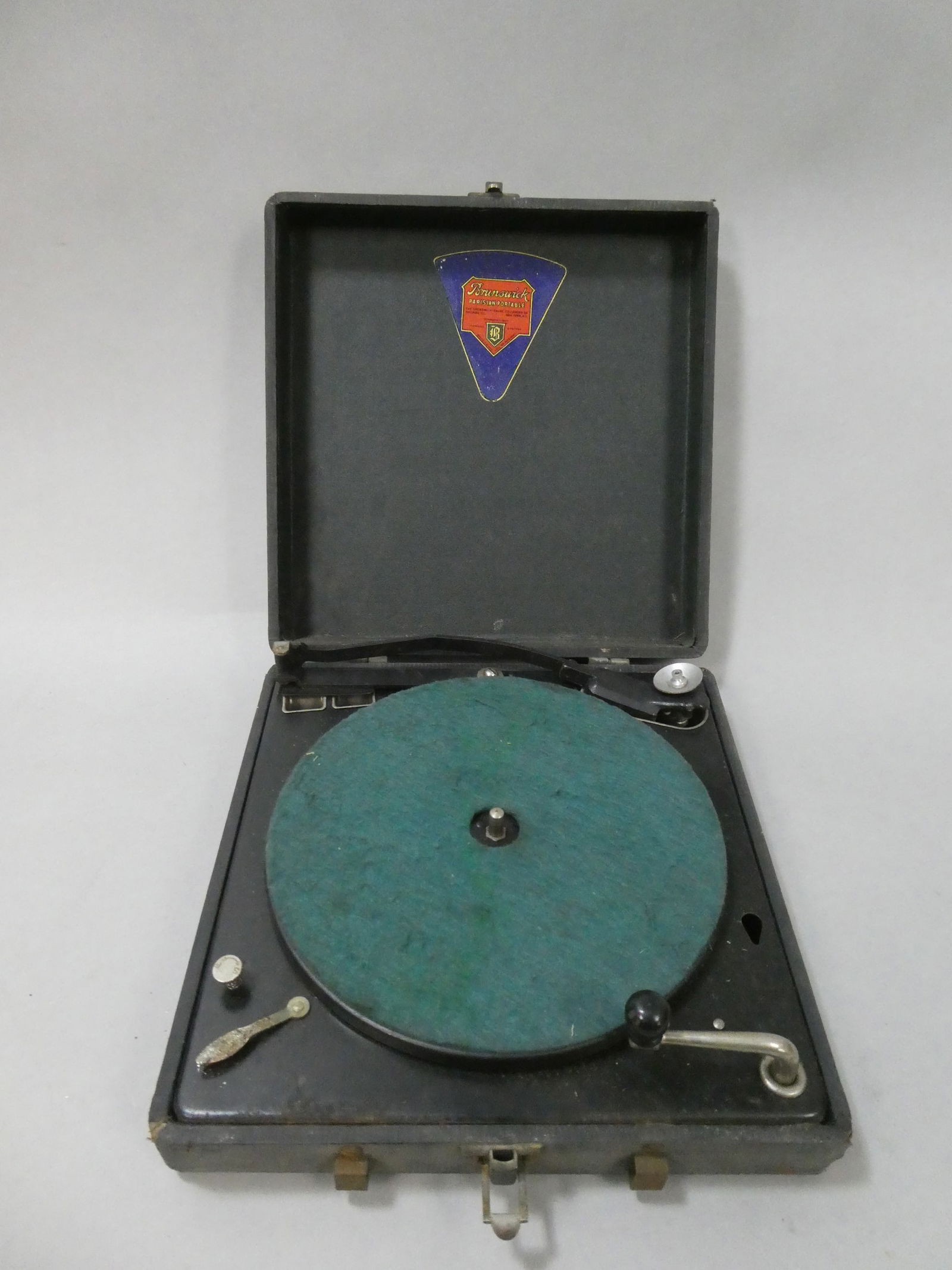 Antique Brunswick Parisian Portable Record Player Turntable: Antique Brunswick Parisian Portable Record Player Turntable. Measurements in inches: 11 x 11 x 3 Condition:Has wear with age and use, Winds up and turntable turns but not tested any further Shipping:W