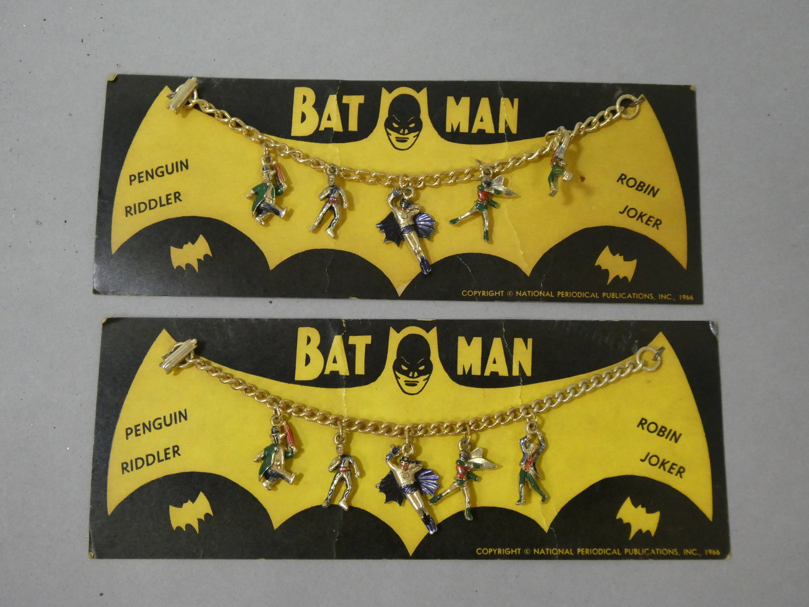 Pair 1966 ORIGINAL Batman Charm Bracelet Original Card National Periodical DC Comics: Pair 1966 ORIGINAL Batman Charm Bracelet Original Card National Periodical DC Comics. Measurements in inches: 8 x 3 Condition:Mild wear with age and use Shipping:We offer in-house shipping. Item(s) wi
