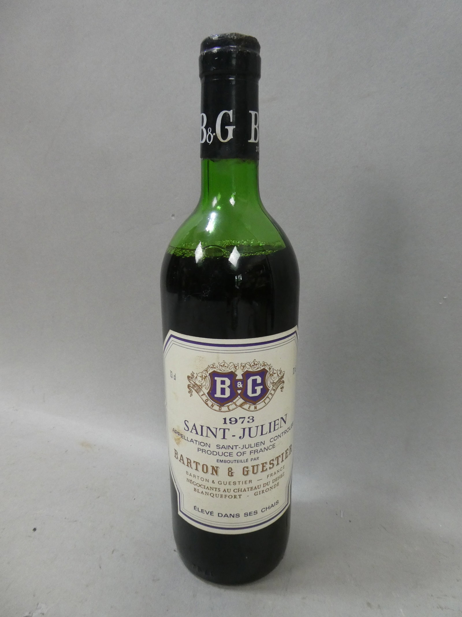1973 Barton & Guestier Thomas Barton Reserve Saint-Julien Red Wine: 1973 Barton & Guestier Thomas Barton Reserve Saint-Julien Red Wine. Not meant for human consumption. For collectable purposes only. Condition:Still sealed, Some wear and soiling to label Shipping:We o