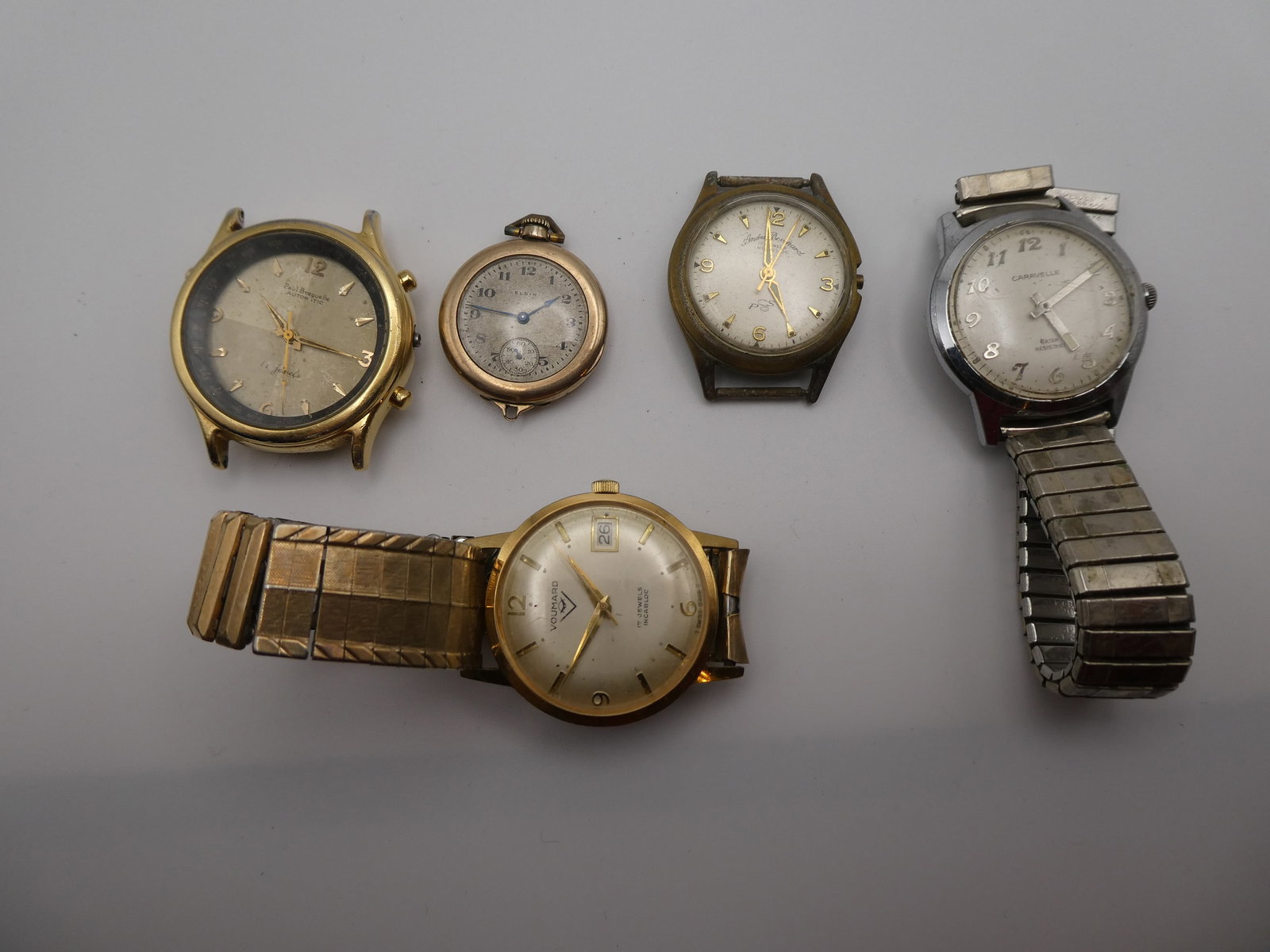 Lot 5 Watches Andre Bouchard Elgin Paul Breguelle Voumard & Caravelle: Lot 5 Watches Andre Bouchard Elgin Paul Breguelle Voumard & Caravelle. Condition:As found Sold as is Shipping:We offer in-house shipping. Item(s) will be packed after invoice is paid and shipping char