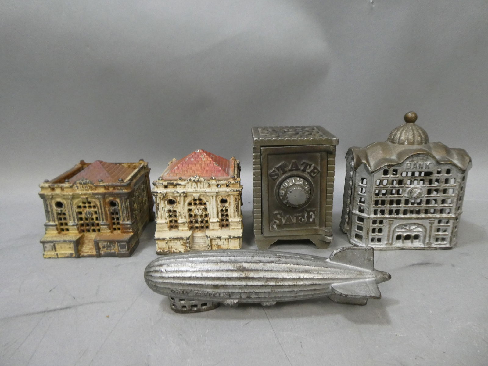 Lot 5 Antique Cast Iron Still Banks Zeppelin Safe Buildings (1 of 8)