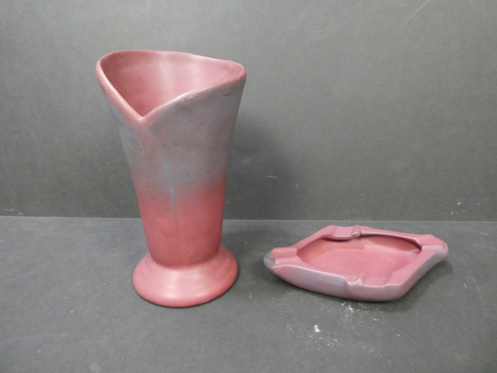 Vintage Van Briggle Burgundy Ats & Crafts Pottery Ashtray and Vase: Vintage Van Briggle Burgundy Ats & Crafts Pottery Ashtray and Vase. Measurements in inches: 7 x 4 ashtray and 8 high x 4 12 diameter vase Condition:Good with no chips, cracks or repairs Shipping:We of