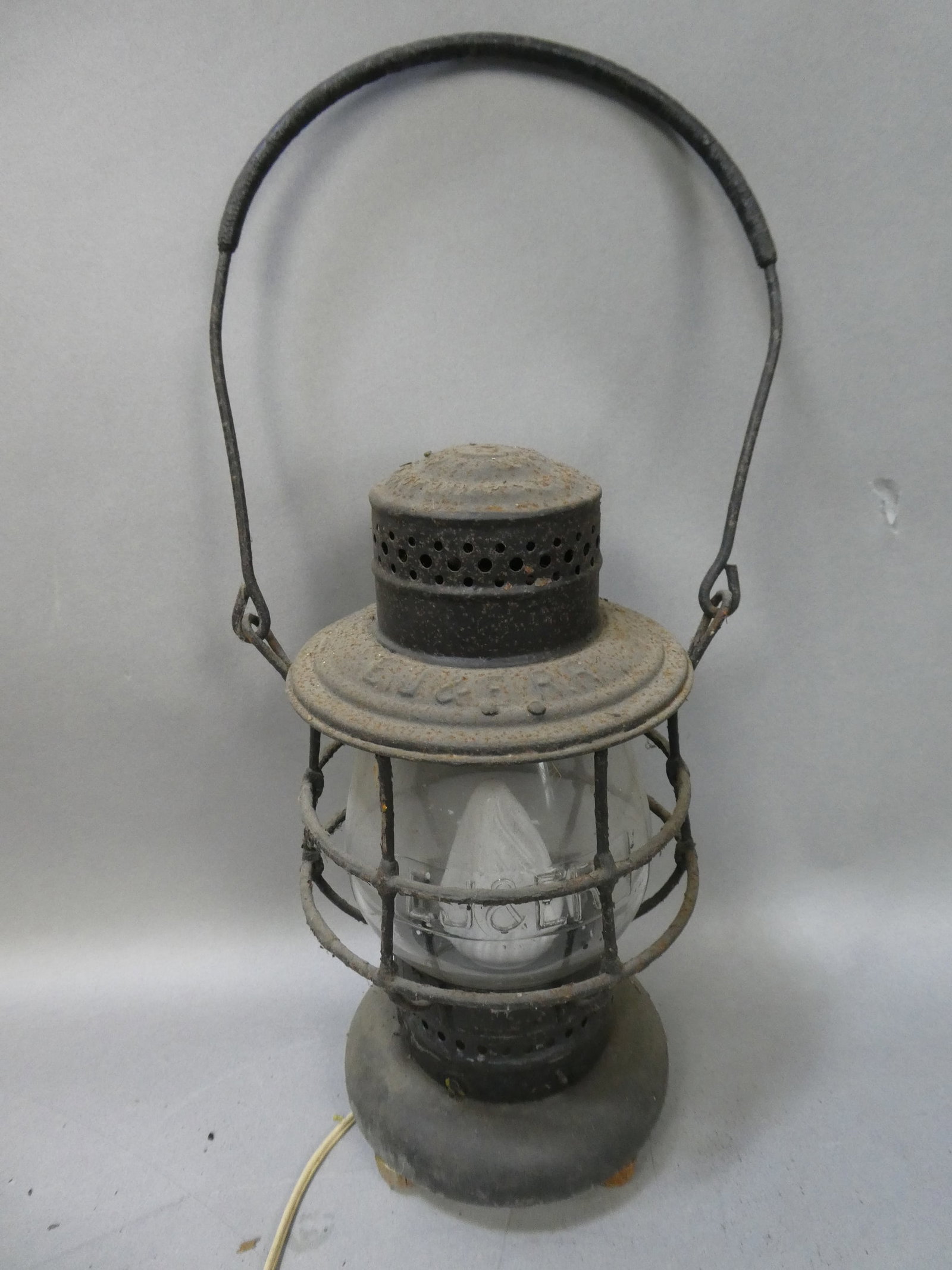 Antique EJ&F Elgin Joliet & Eastern Railroad Lamp Lantern: Antique EJ&F Elgin Joliet & Eastern Railroad Lamp Lantern with embossed glass. Measurements in inches: 12 high x 6 diameter Condition:As found, converted to a lamp, has a thin crack, surface rust and 