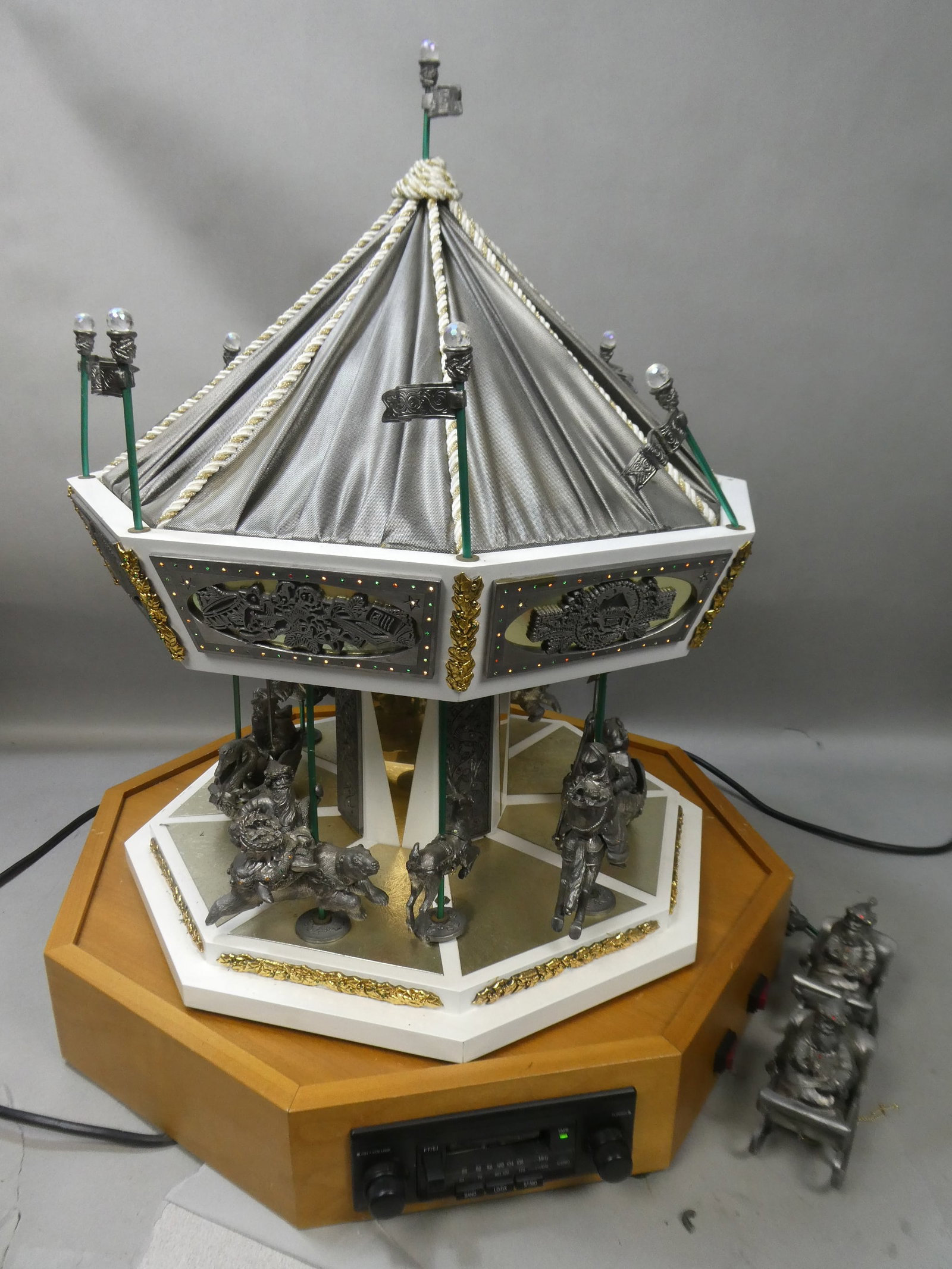Michael Anthony Ricker Pewter Ltd Ed The Christmas Carousel: Michael Anthony Ricker Pewter Ltd Ed The Christmas Carousel. Number 64/175. Measurements in inches: 86 lbs/ 31 high x 24 across Condition:One flag is broken off, one rung on Santa sled is broken. Turn