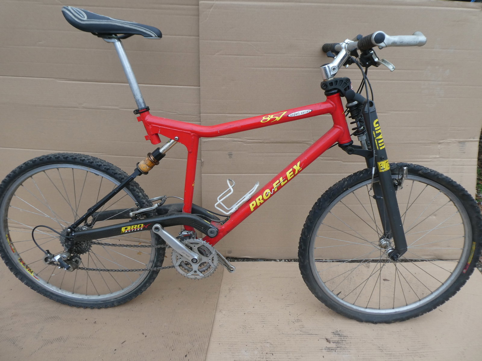 1990's Proflex 857 Expert Series Full Suspension Mountain Bike Bicycle: 1990's Proflex 857 Expert Series Full Suspension Mountain Bike Bicycle with Noleen Girvin Elite front suspension, Shimano Deore Xtcomponents, aluminum frame with carbon. Measurements in inches: 31" do